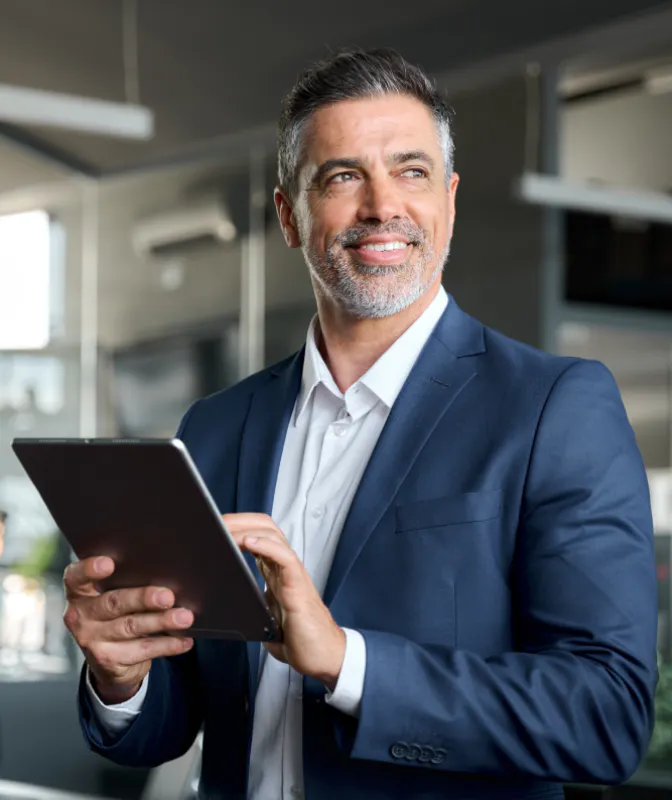 A midlife executive smiling.