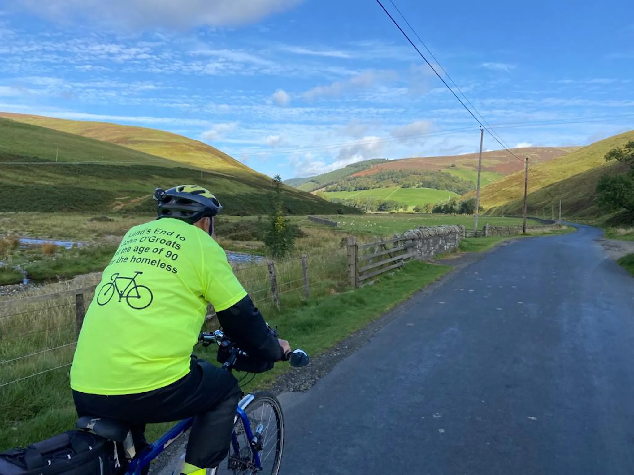 Peter Langford on his bike cycling to John O Groats