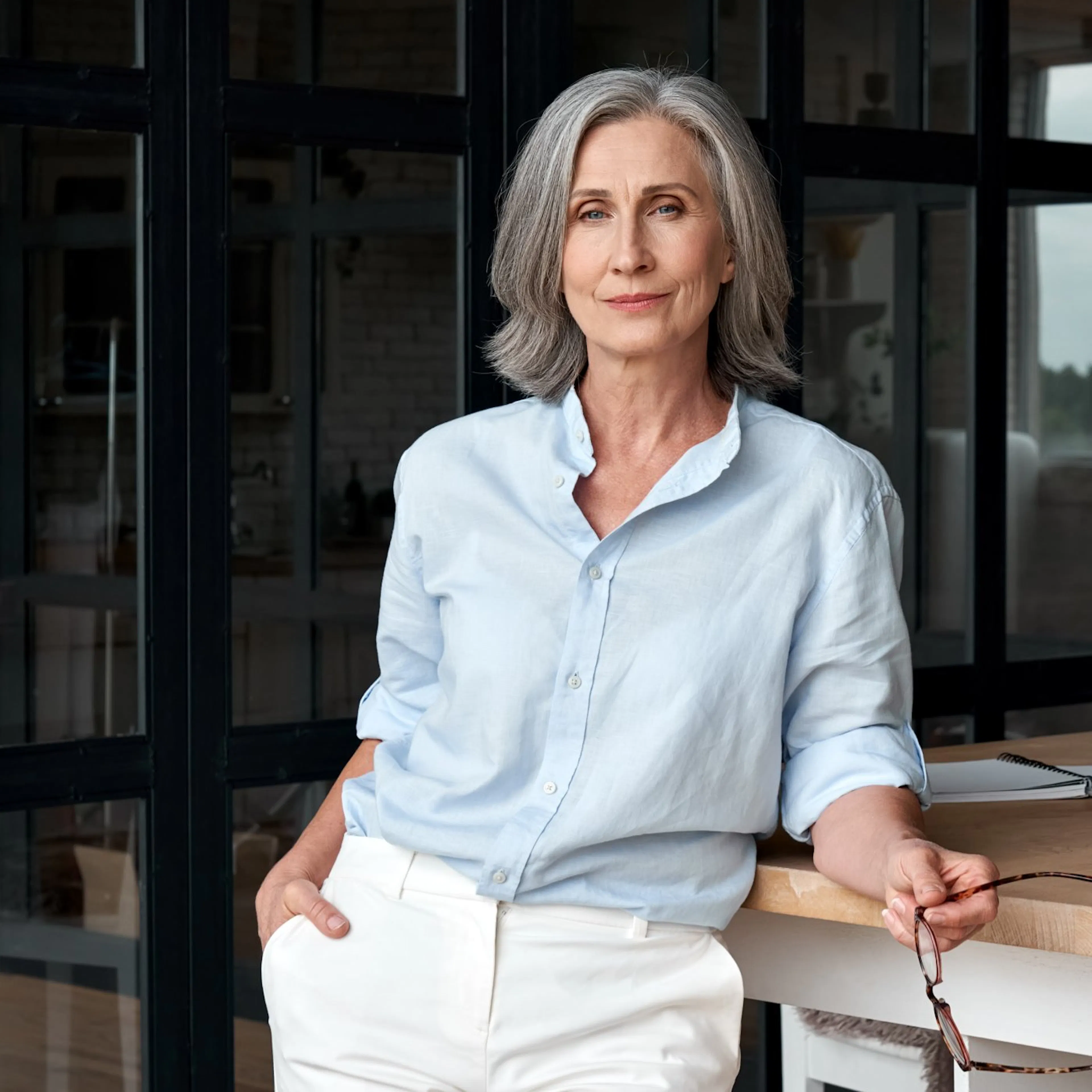 Confident senior executive in her office