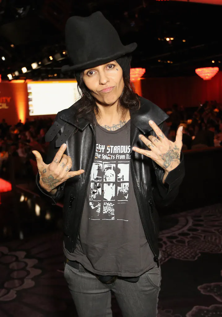 Linda Perry gesturing at camera