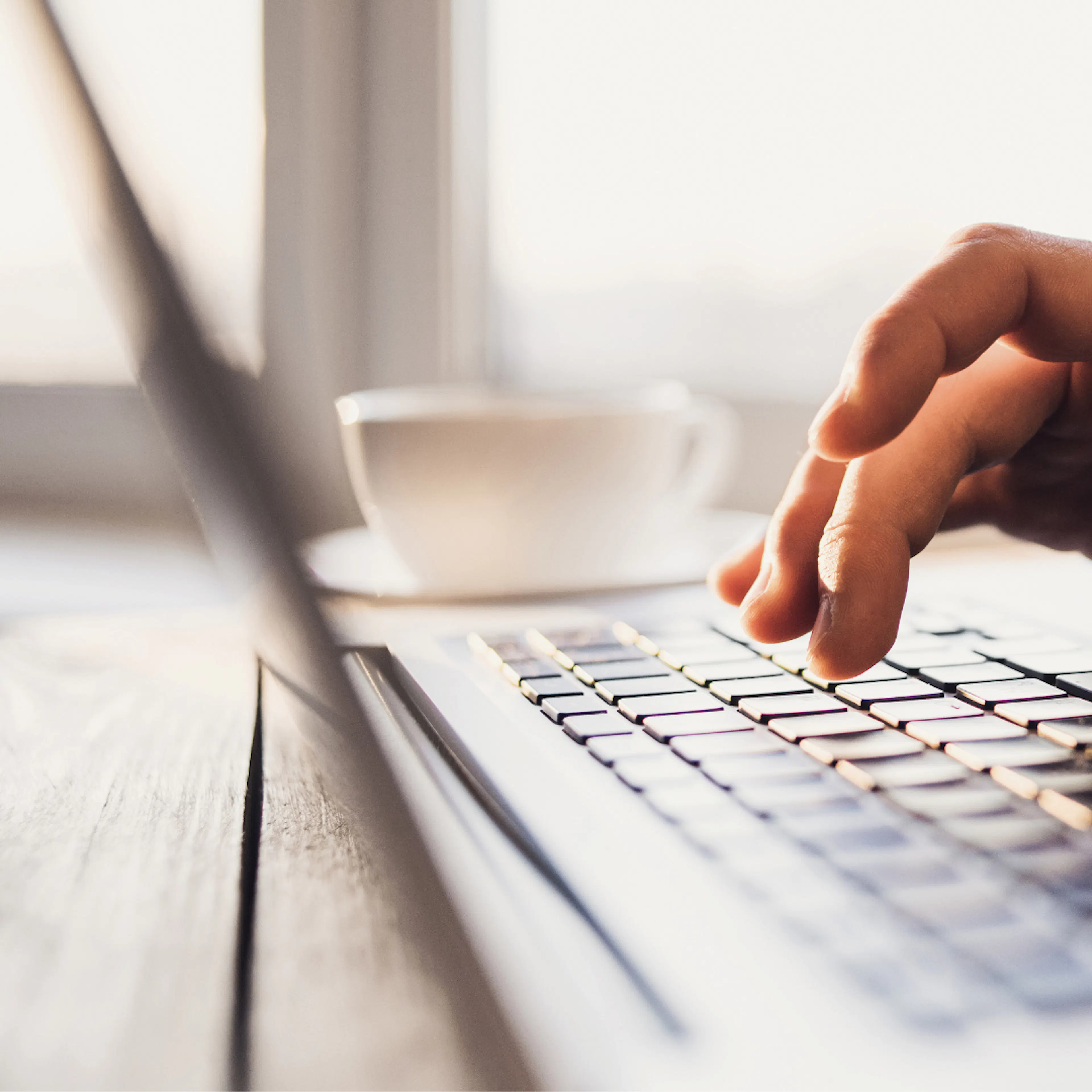 Close up of hands on a keyboard