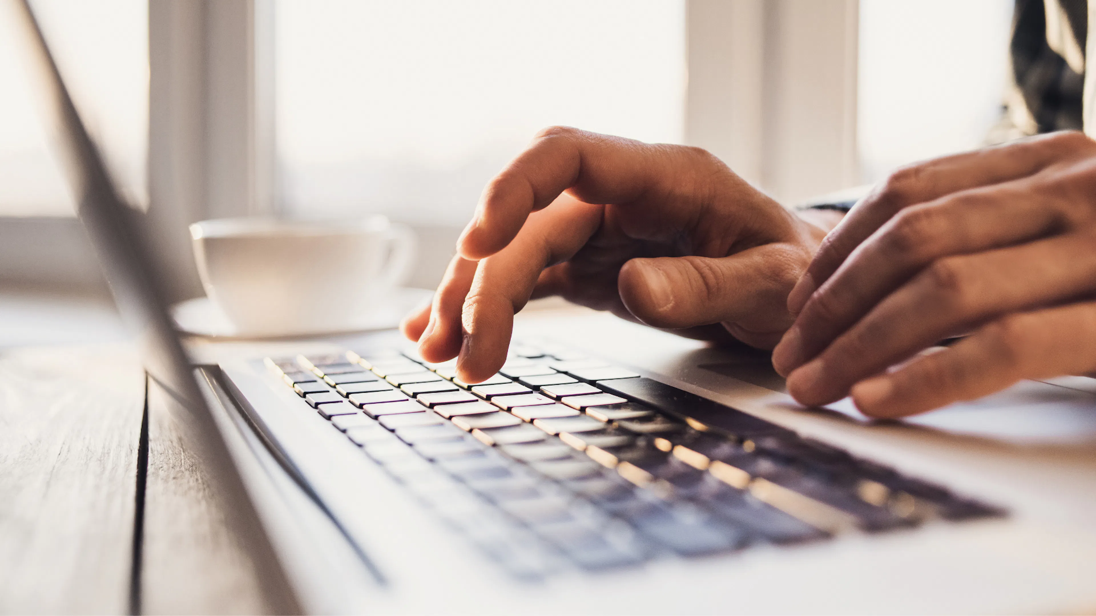 Close up of hands on a keyboard