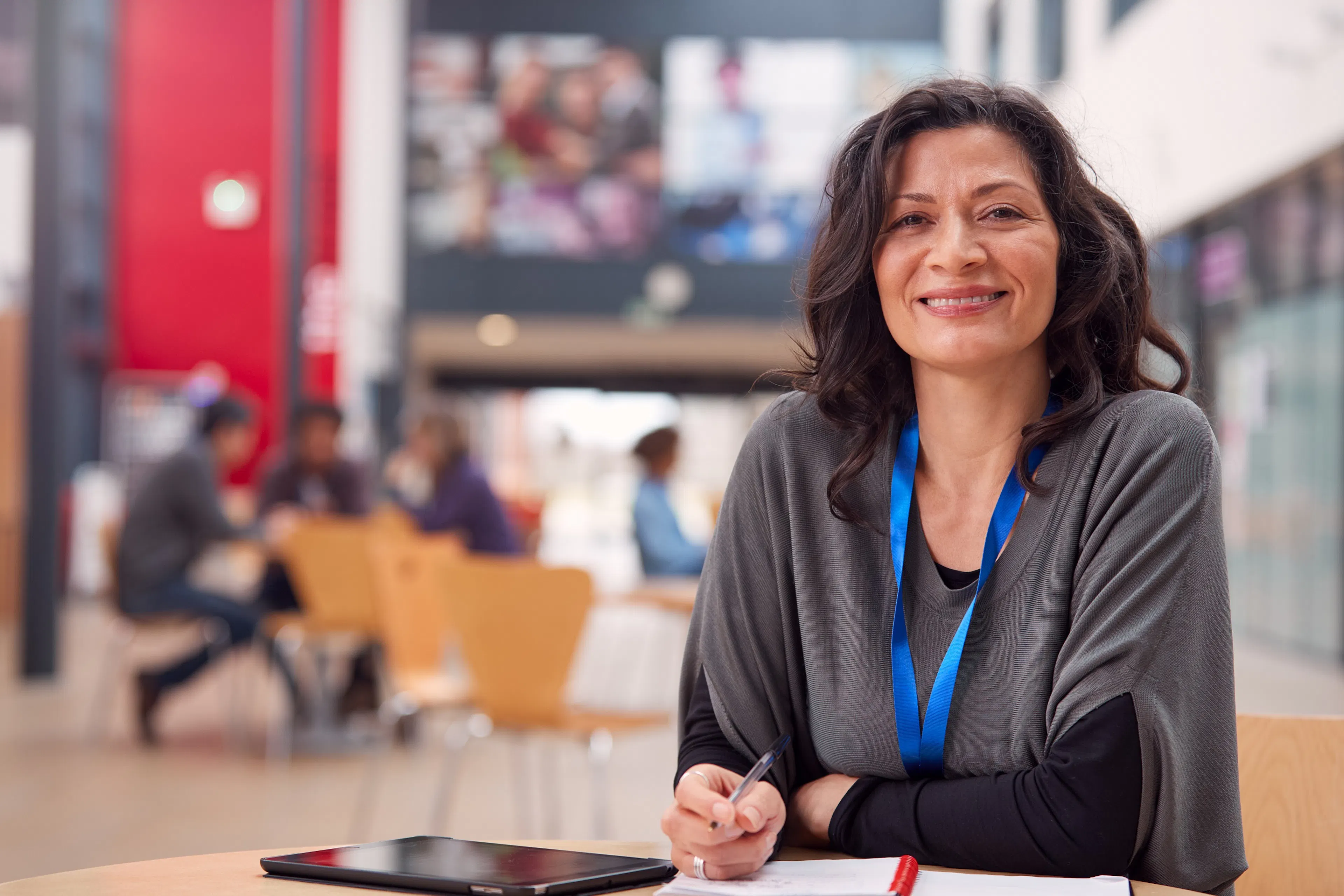female employee facing camera in seating area