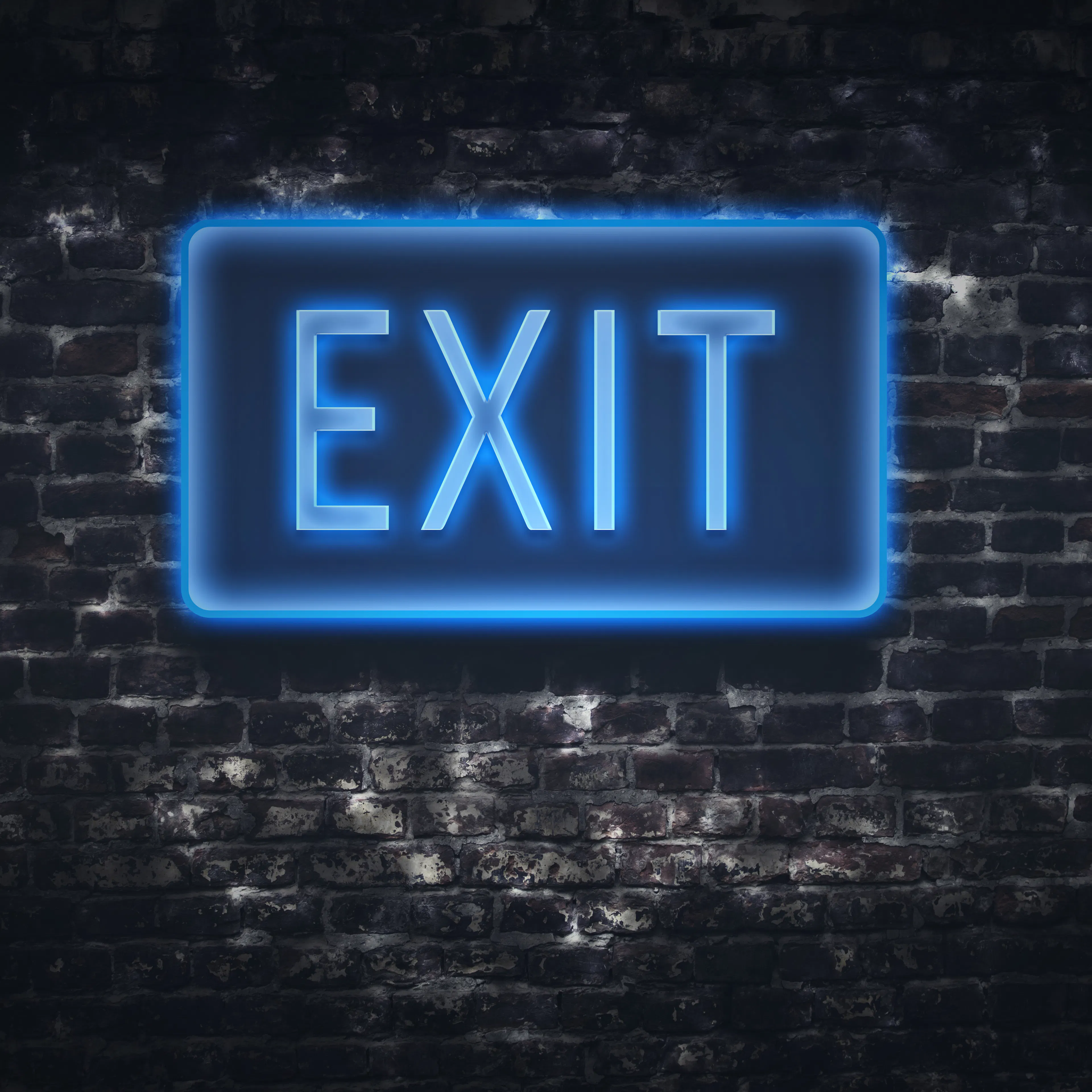 blue fluorescent exit sign on brick wall