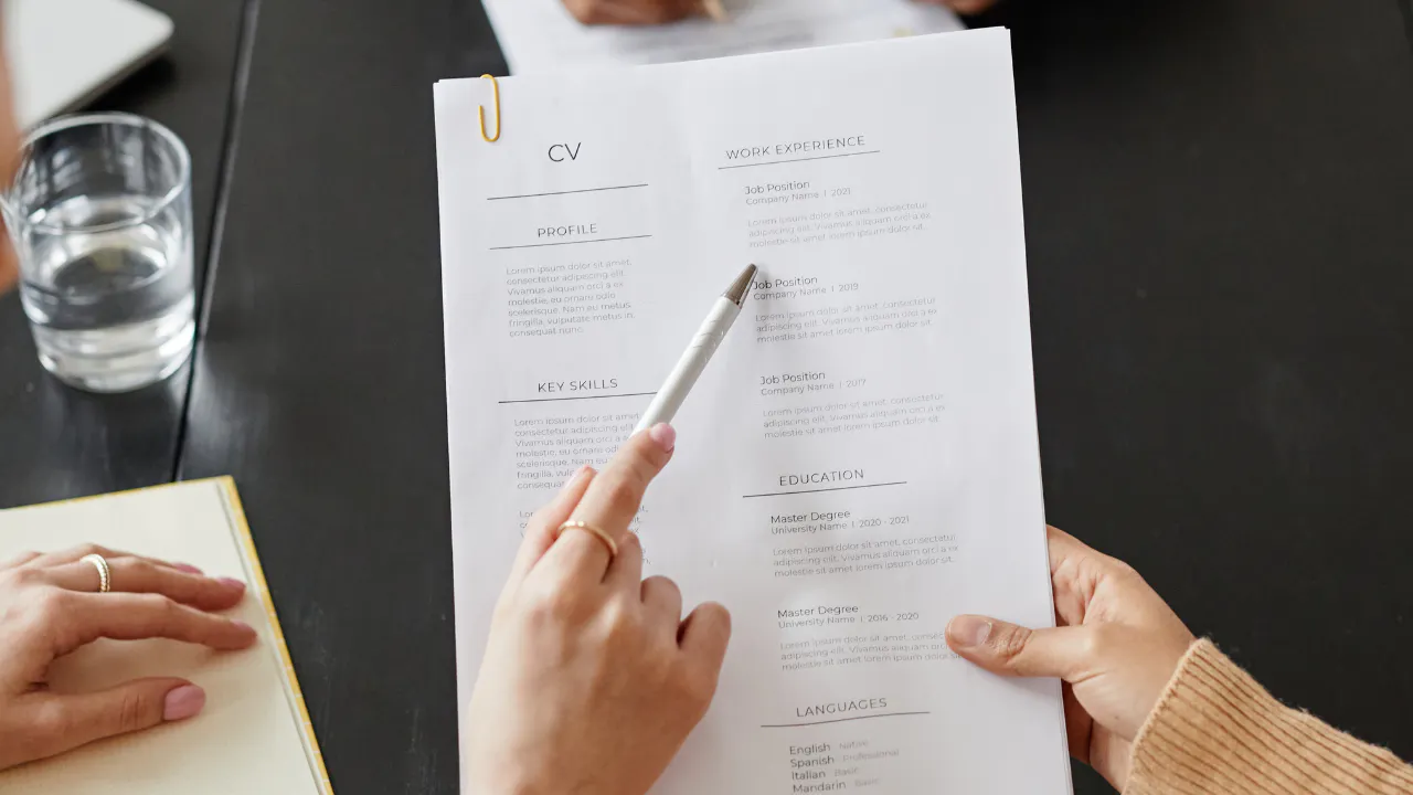 Two women looking at someones CV