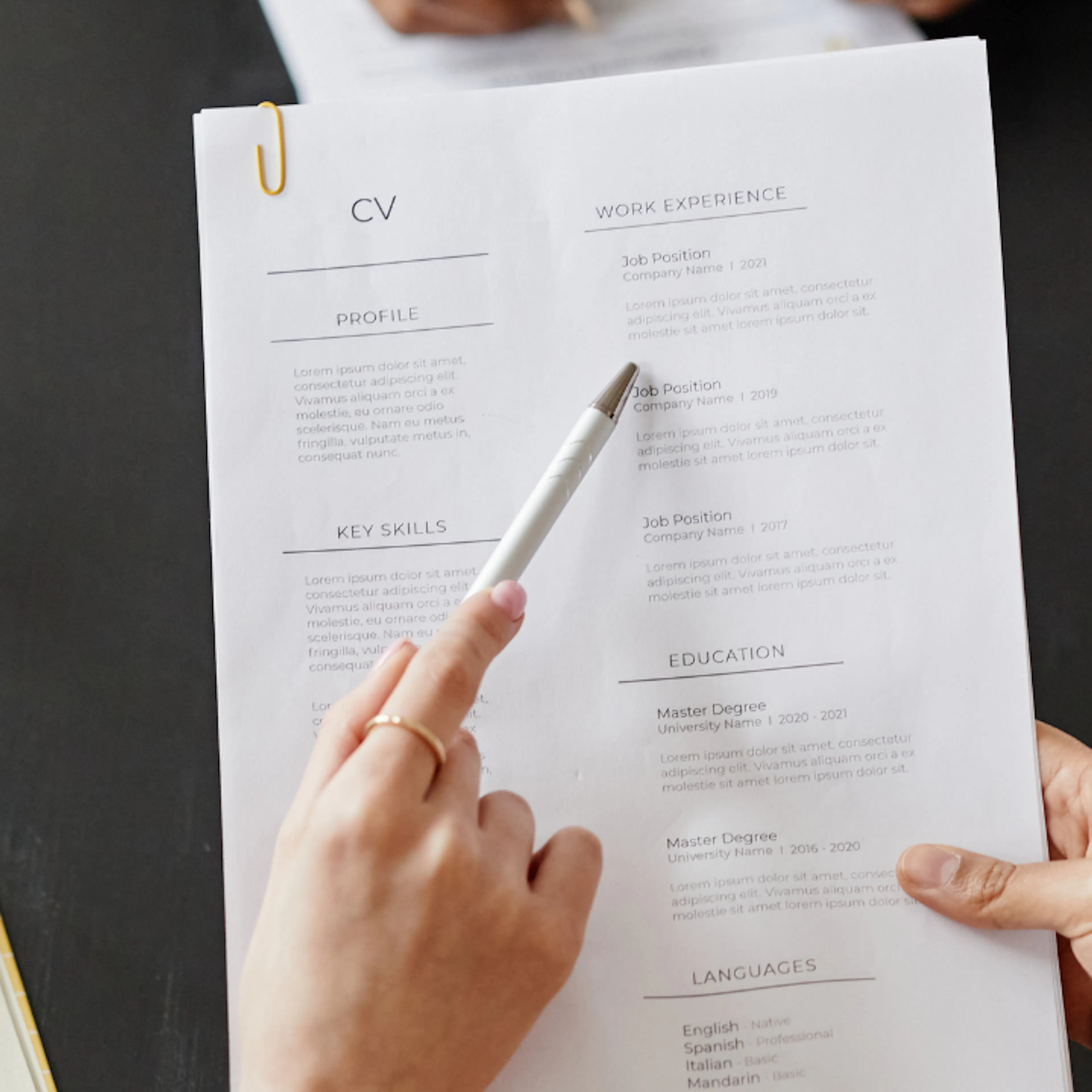 Two women looking at someones CV