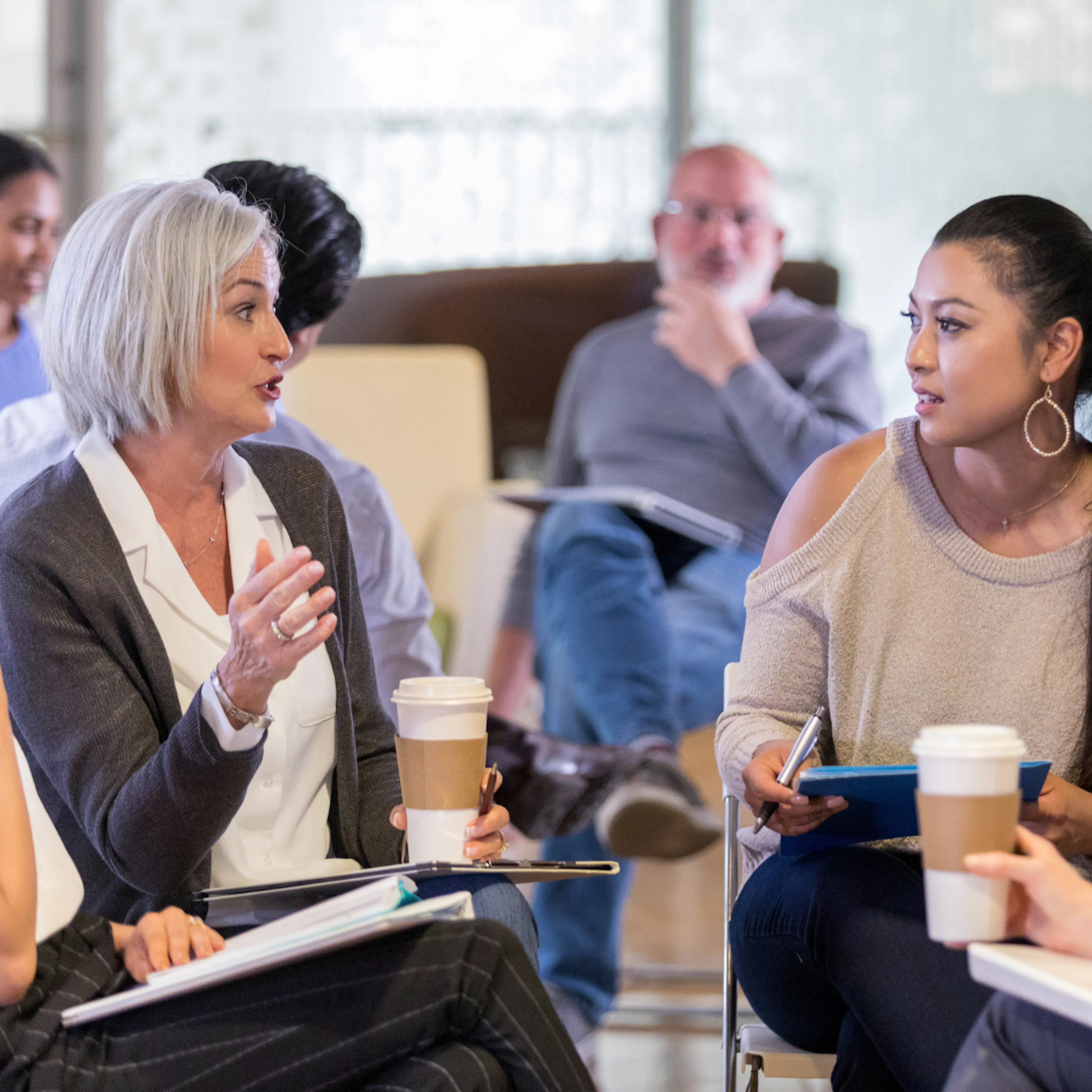 Multi generation and diverse ethnic group chatting