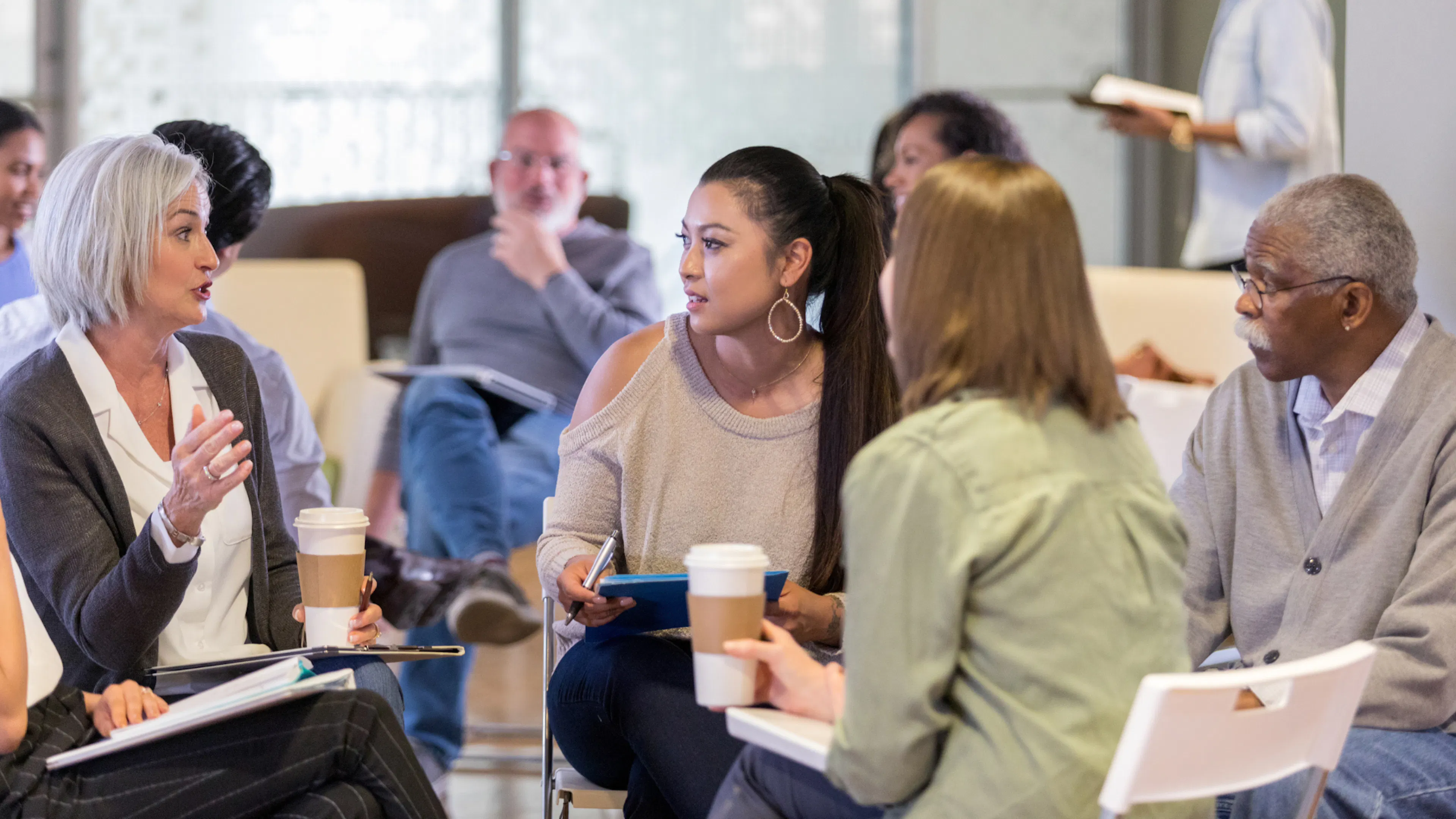 Multi generation and diverse ethnic group chatting
