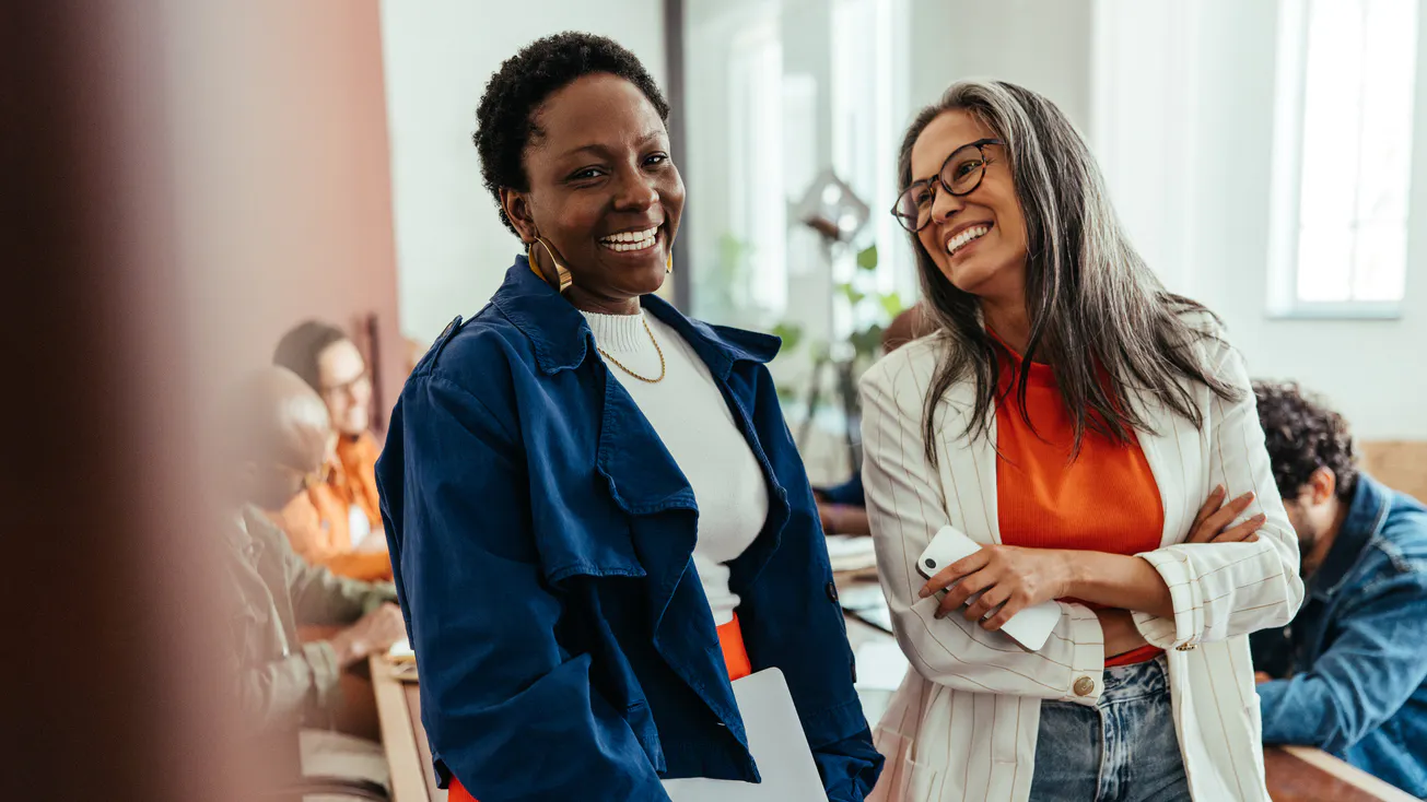two women smiling at work