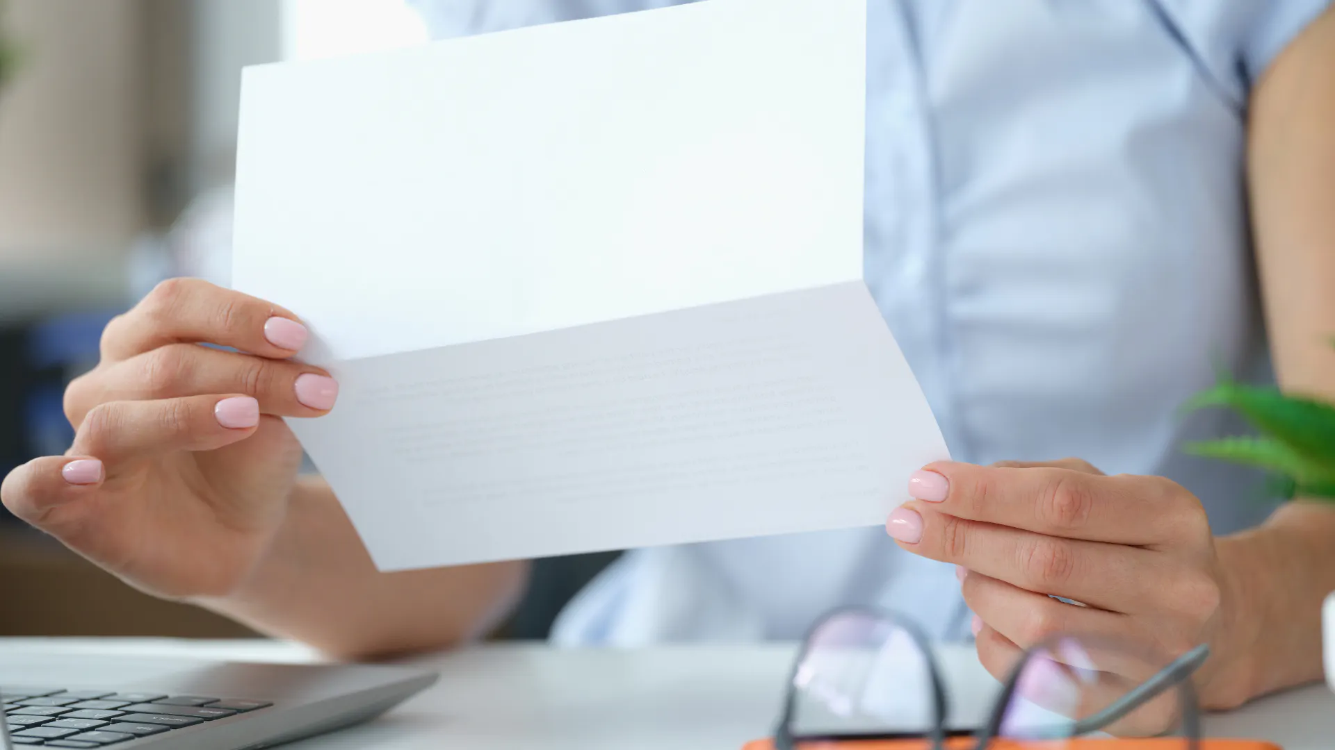 Hands holding a letter