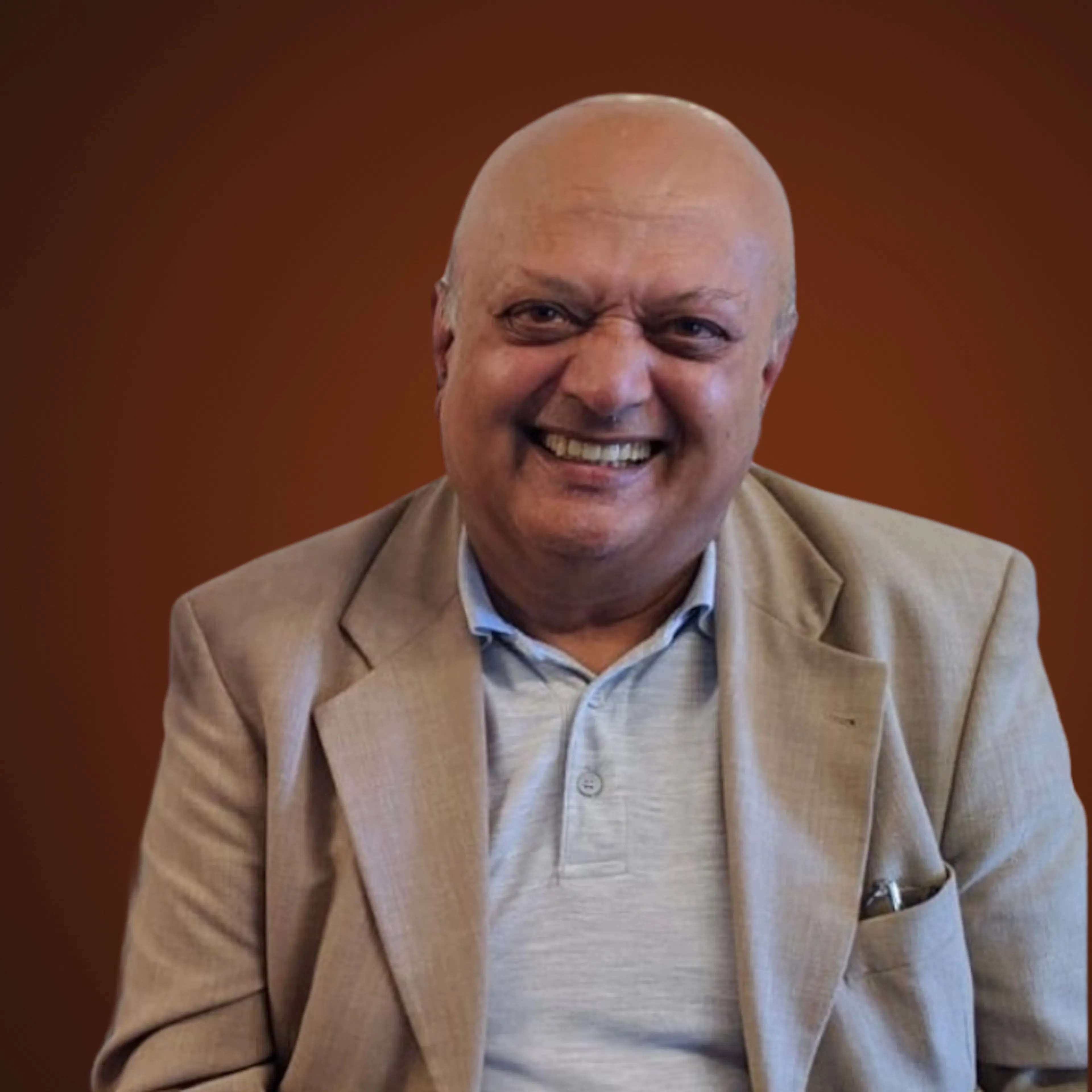 Des Desai Headshot, smiling at camera