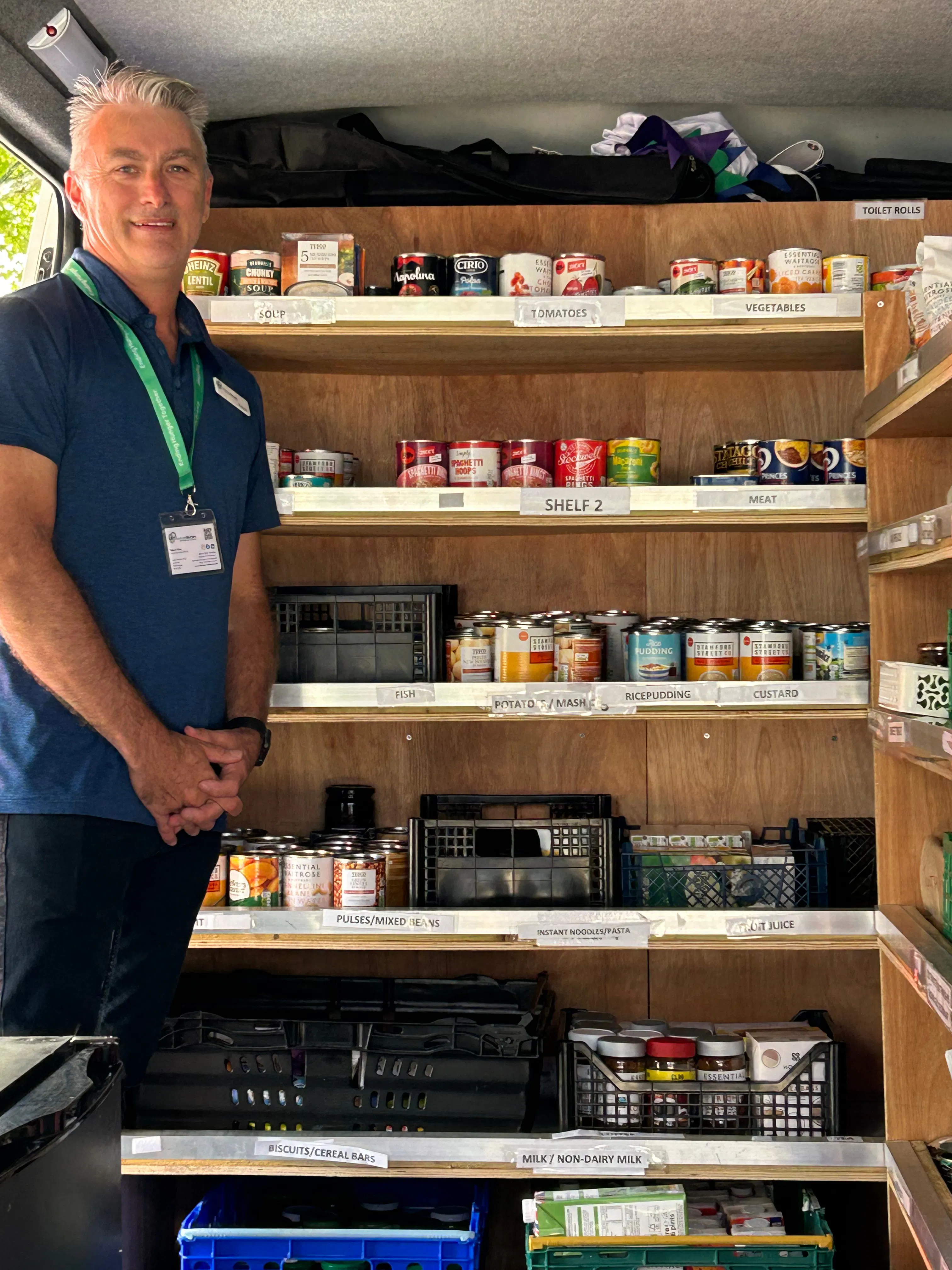 Portrait of Kelvin in front of community larder