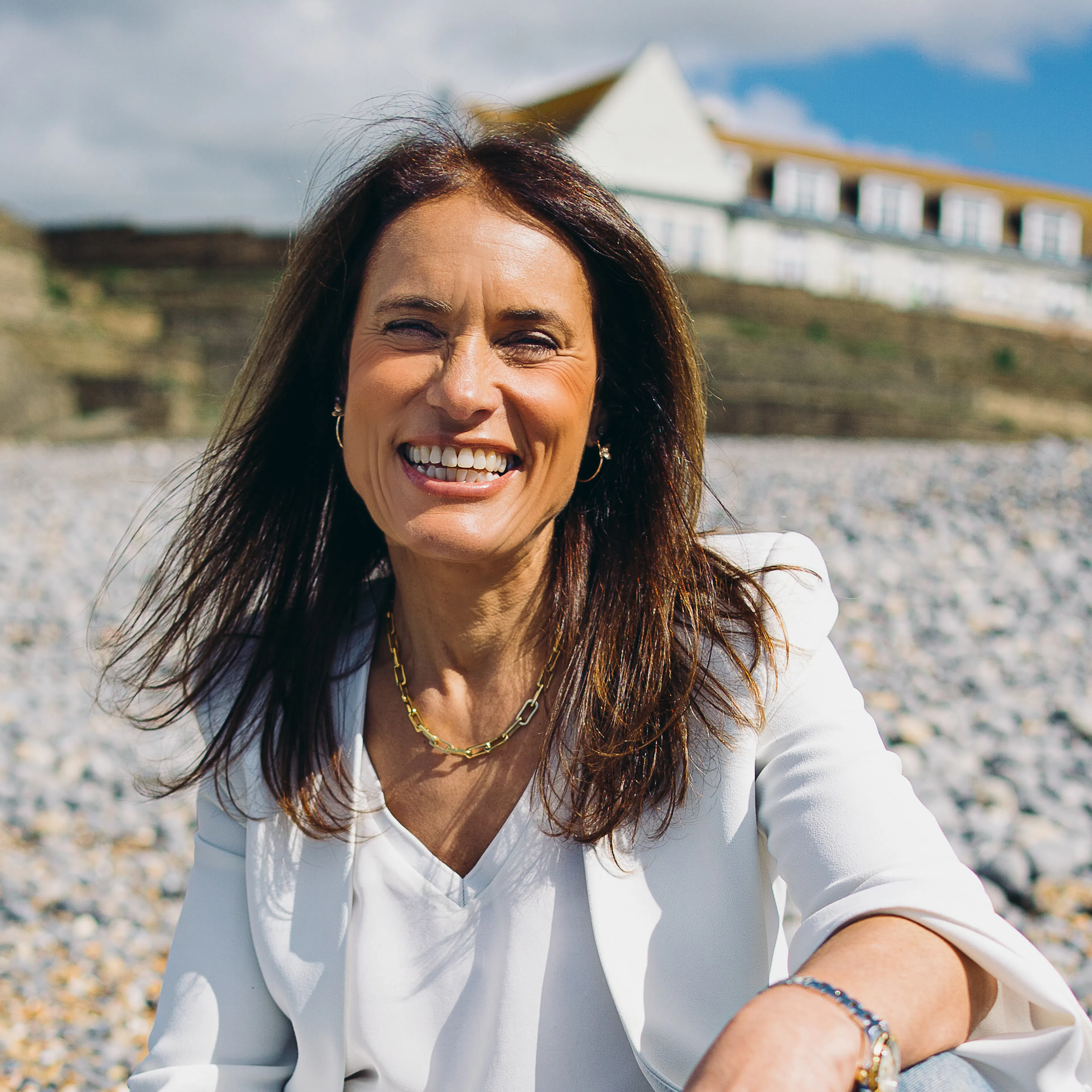 Lisa Nunn sitting on beach
