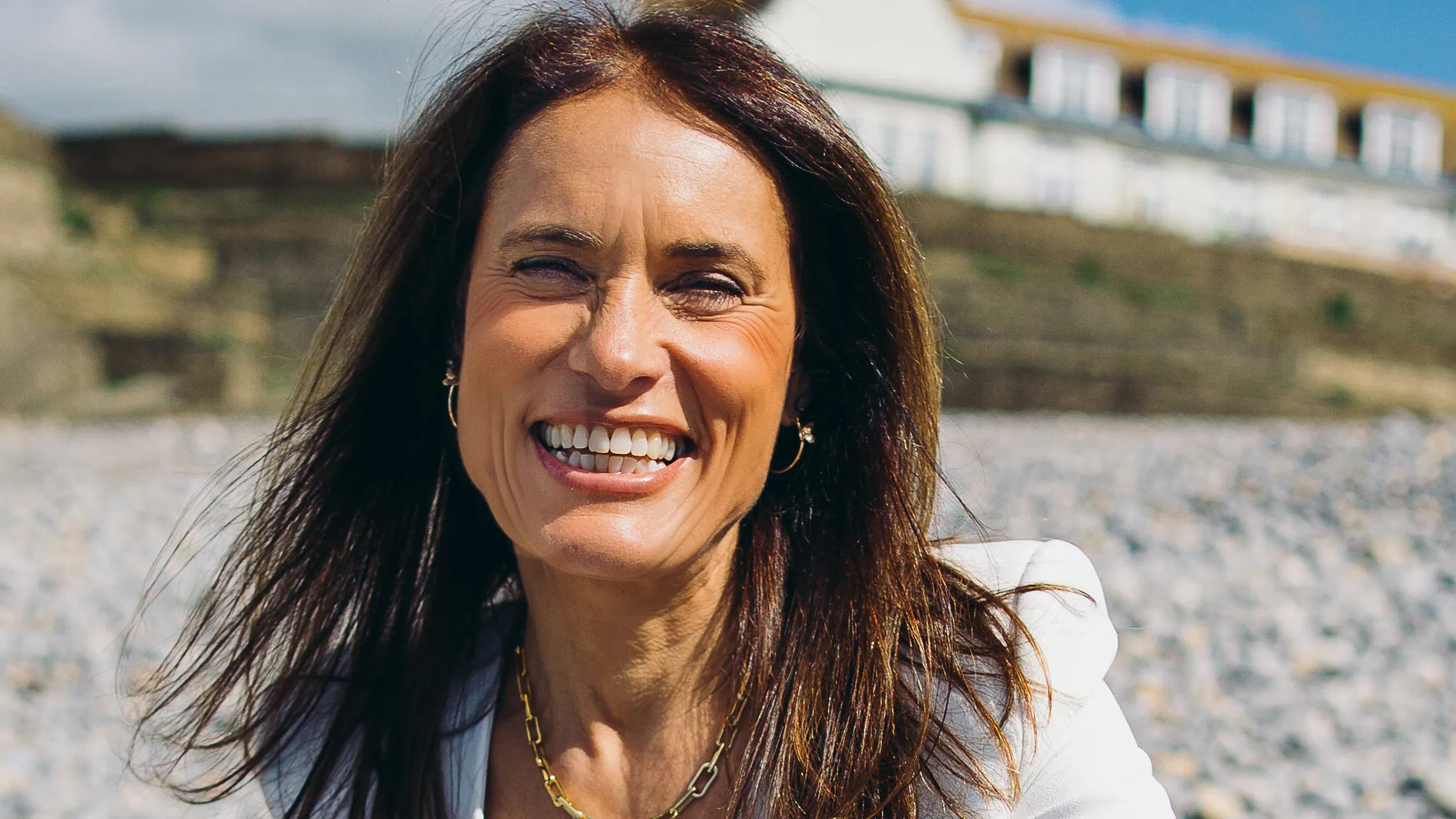 Lisa Nunn sitting on beach