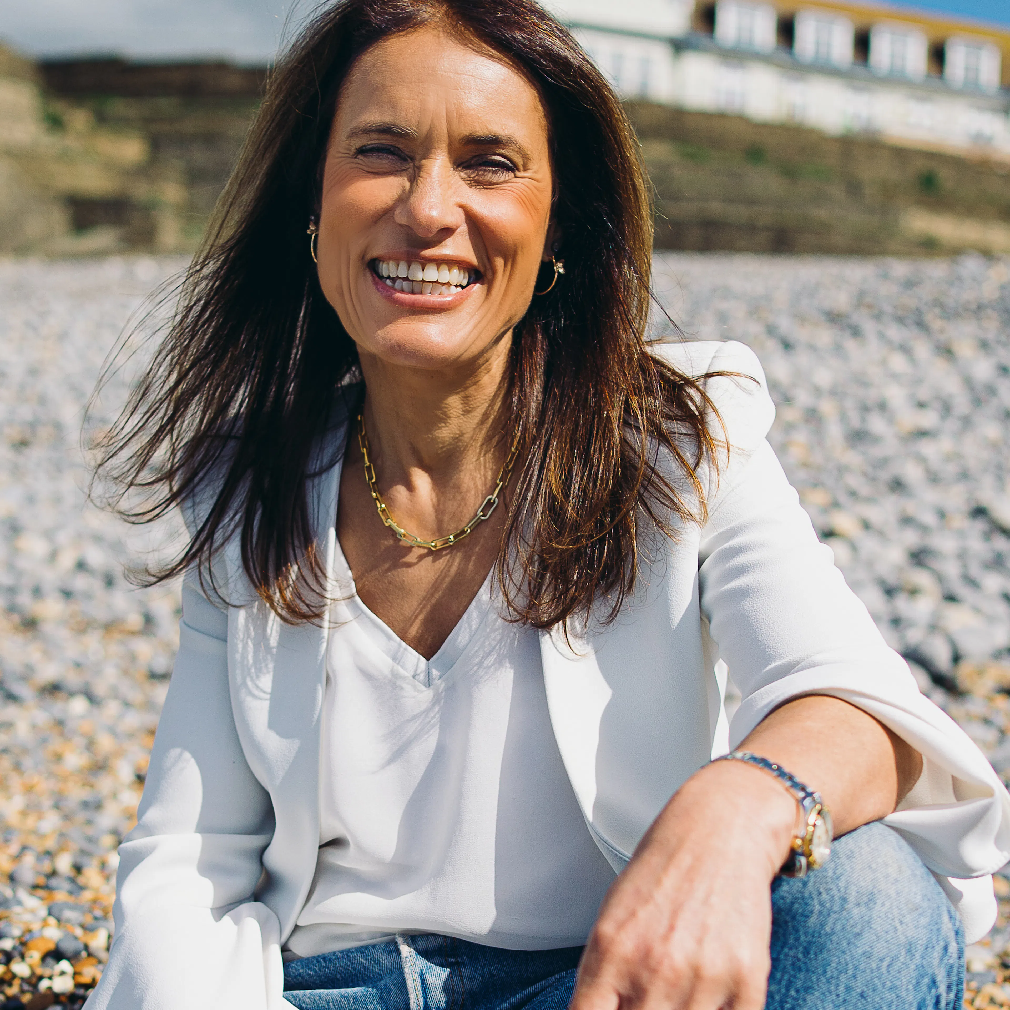 Lisa Nunn sitting on beach
