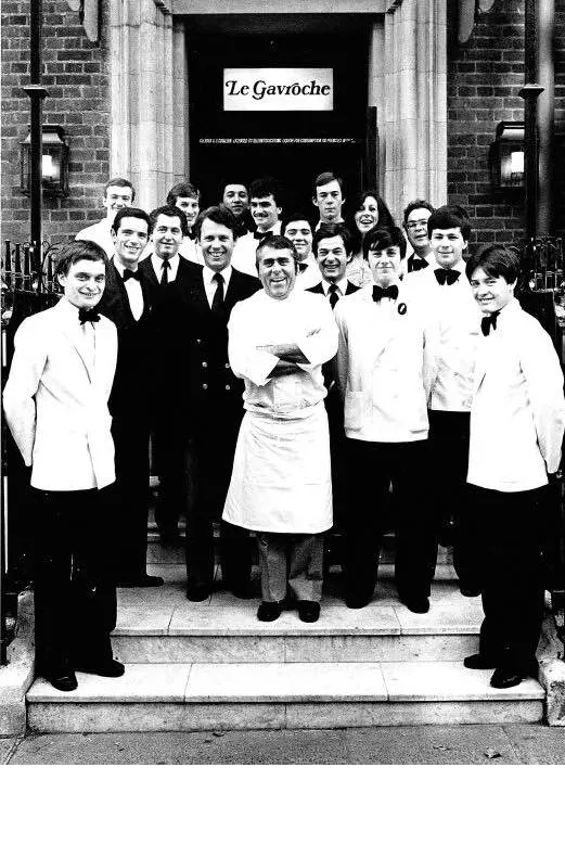 Albert Roux on the steps to Le Gavroche with his unformed team