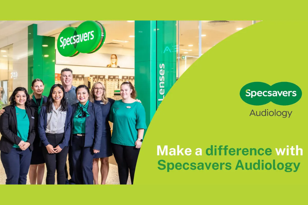 Specsavers audiology advert. Team members pictured outside a store.