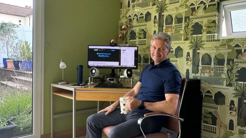 Adrian Whitcombe sitting at desk