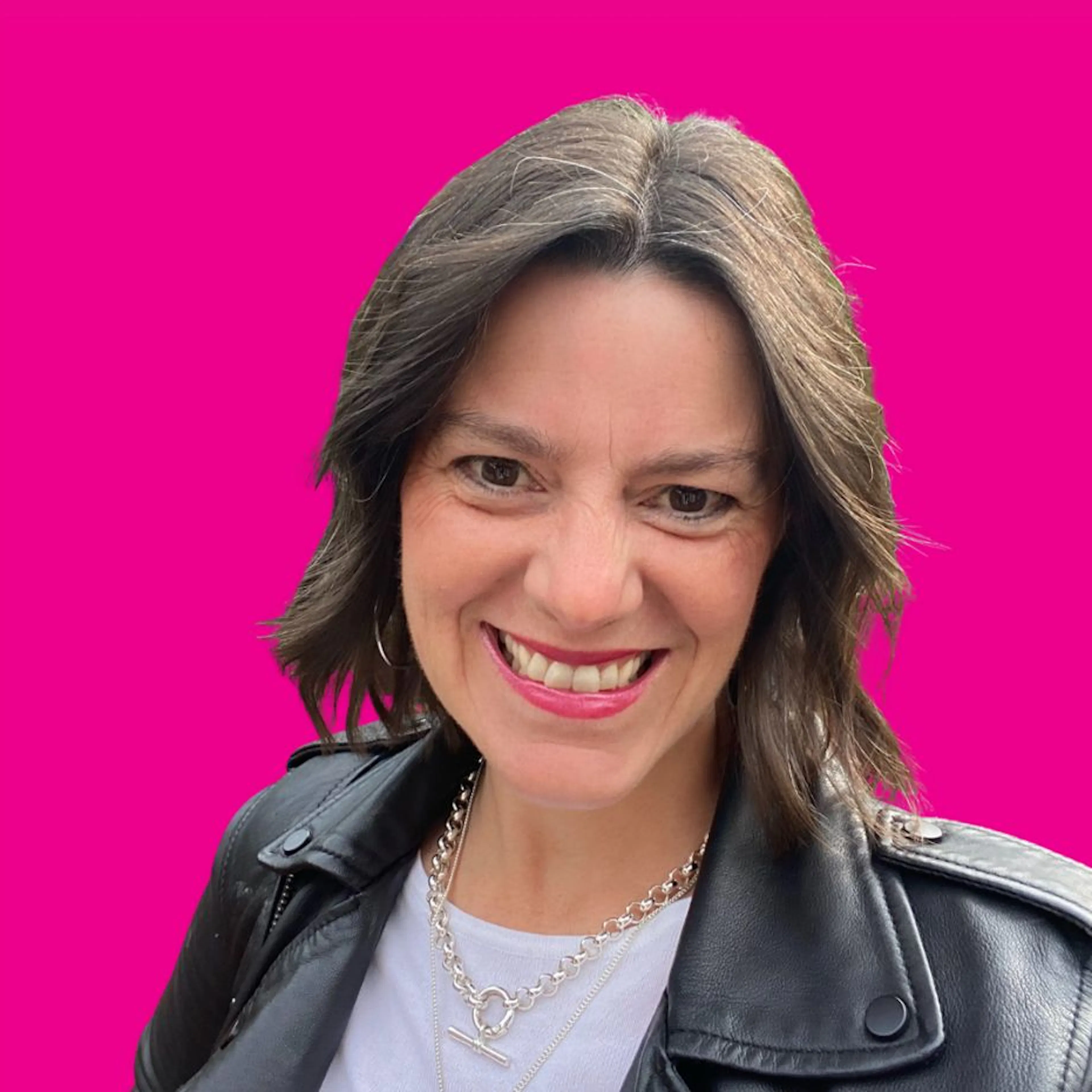 Portrait of Ali Spooner on pink background