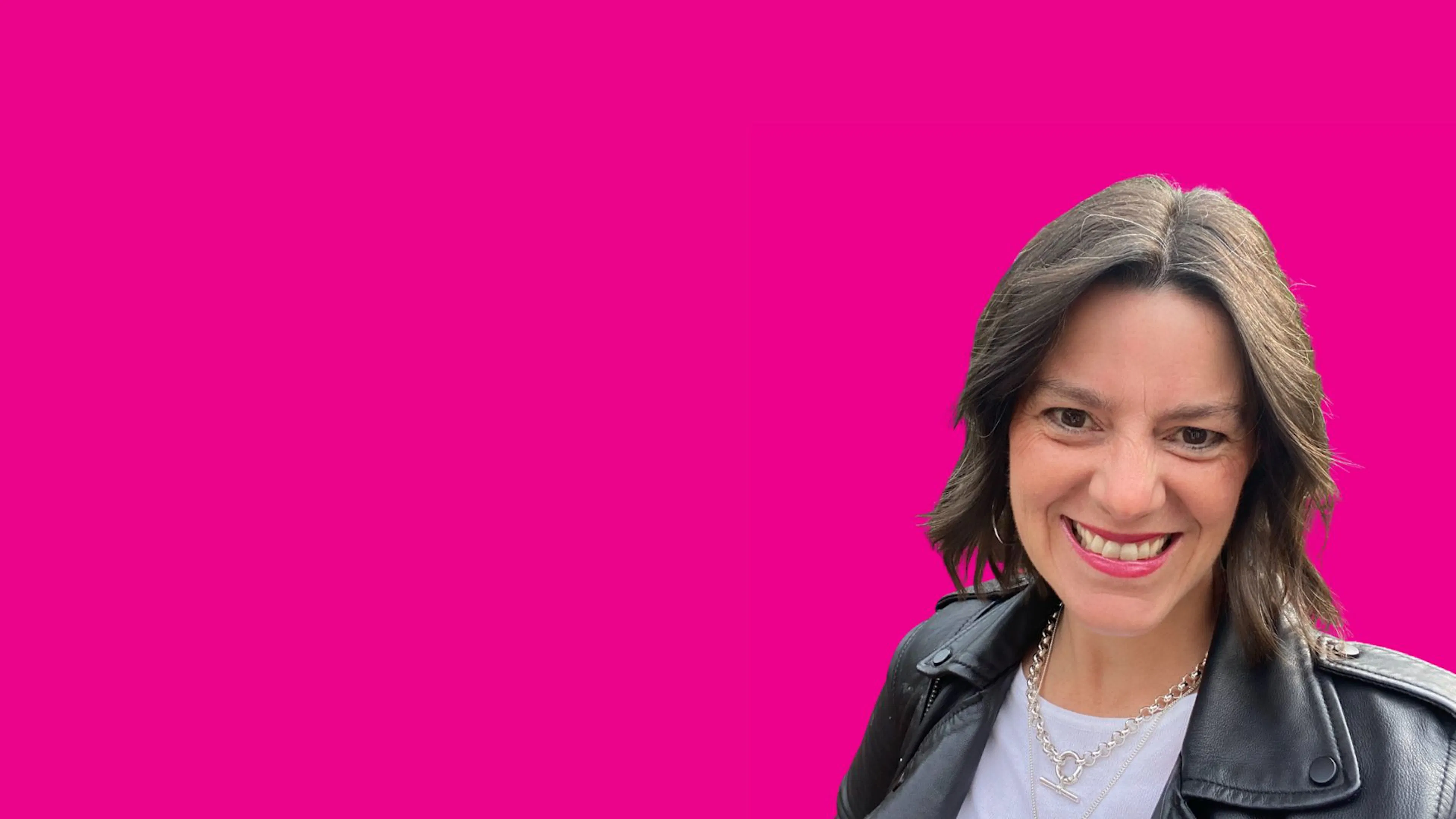 Portrait of Ali Spooner on pink background