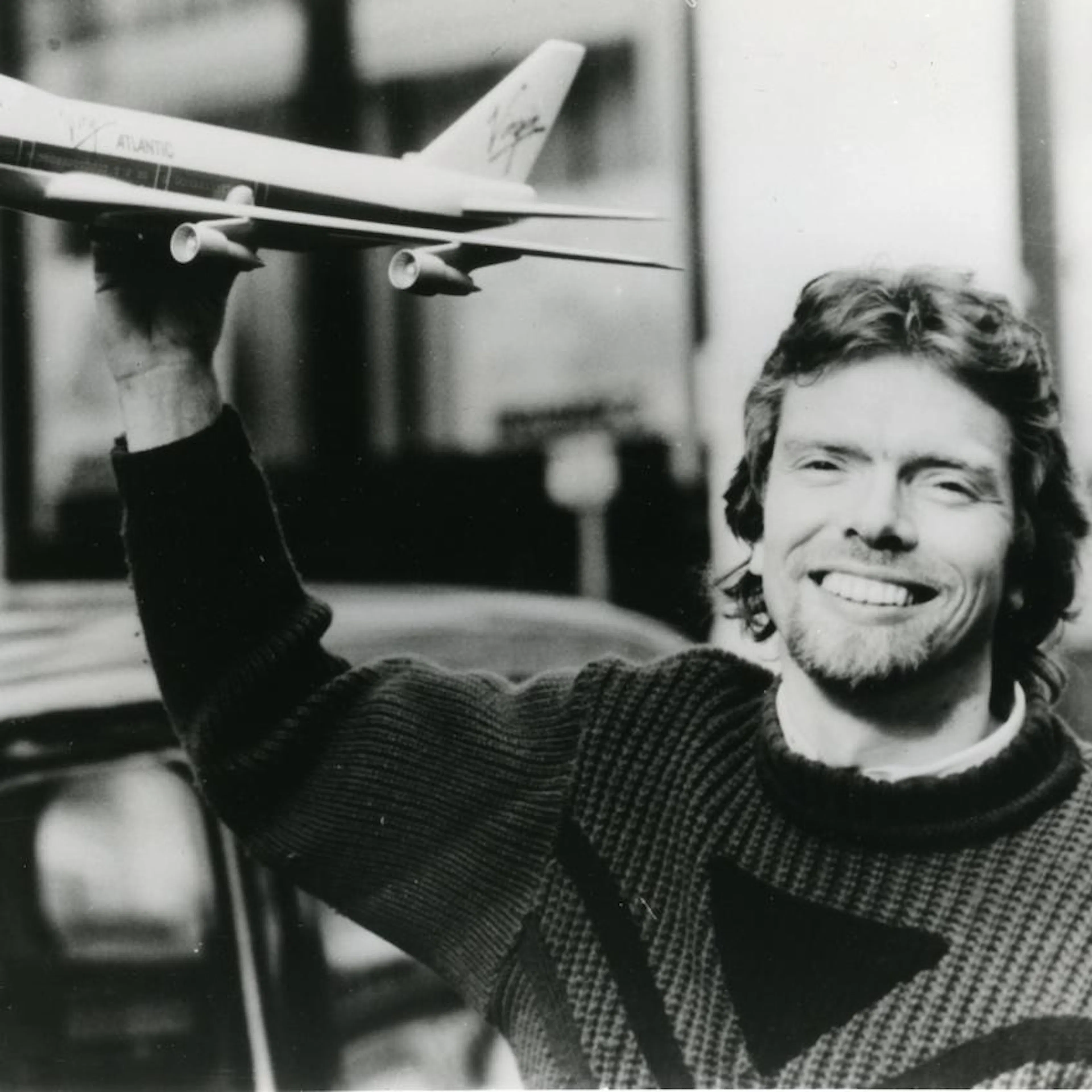 Richard Branson B&W portrait holding model plane