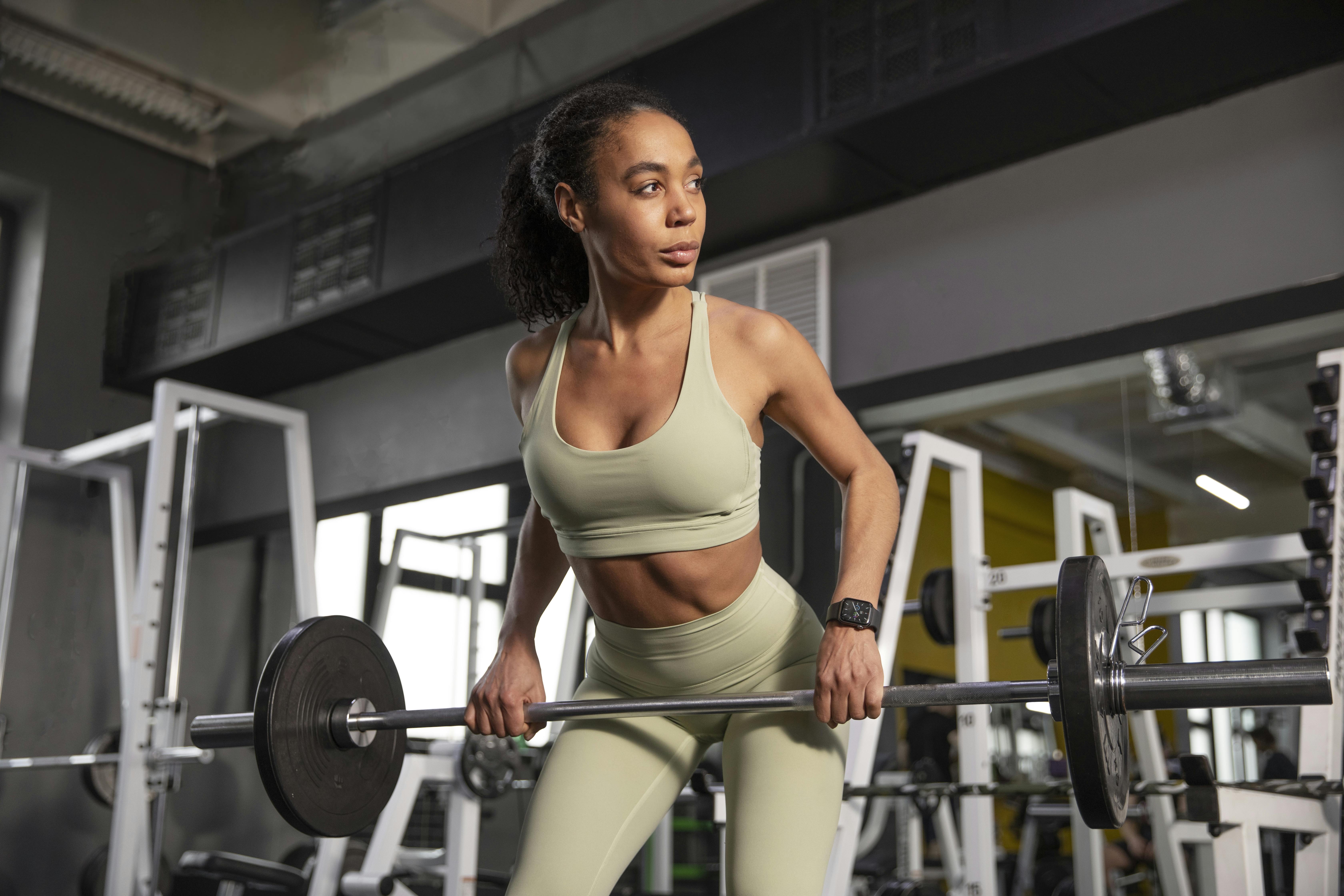 A woman weightlifting in the gym.