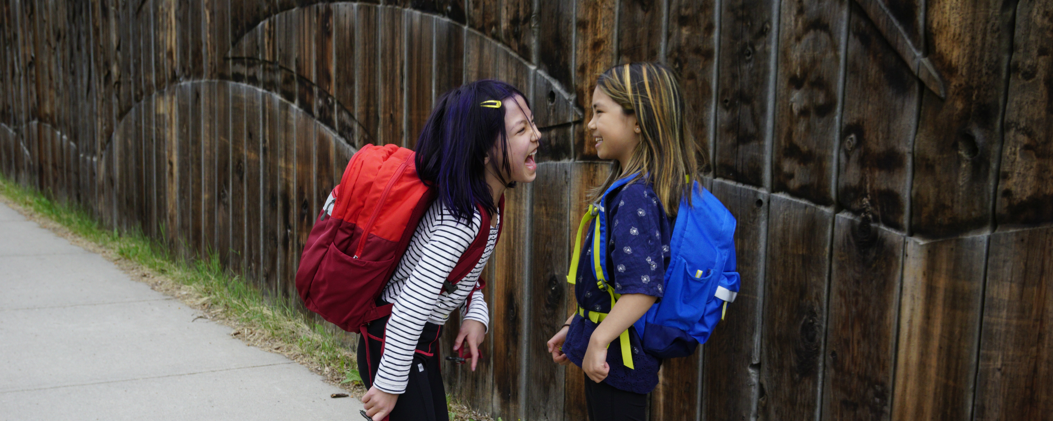 Kid with outlet big backpack