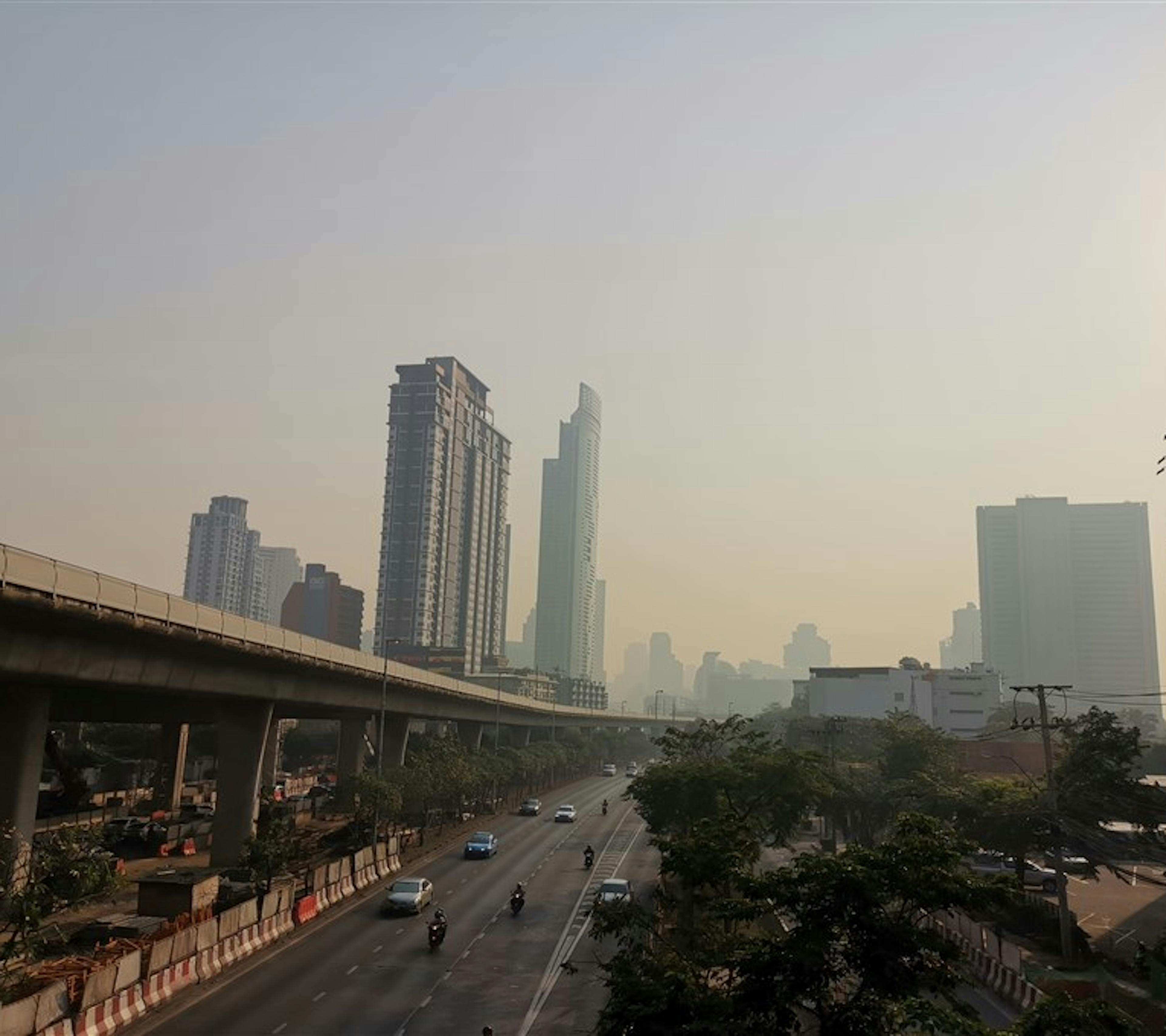 Smog over an Asian city caused by a combination of vehicle exhaust and industrial pollutants.