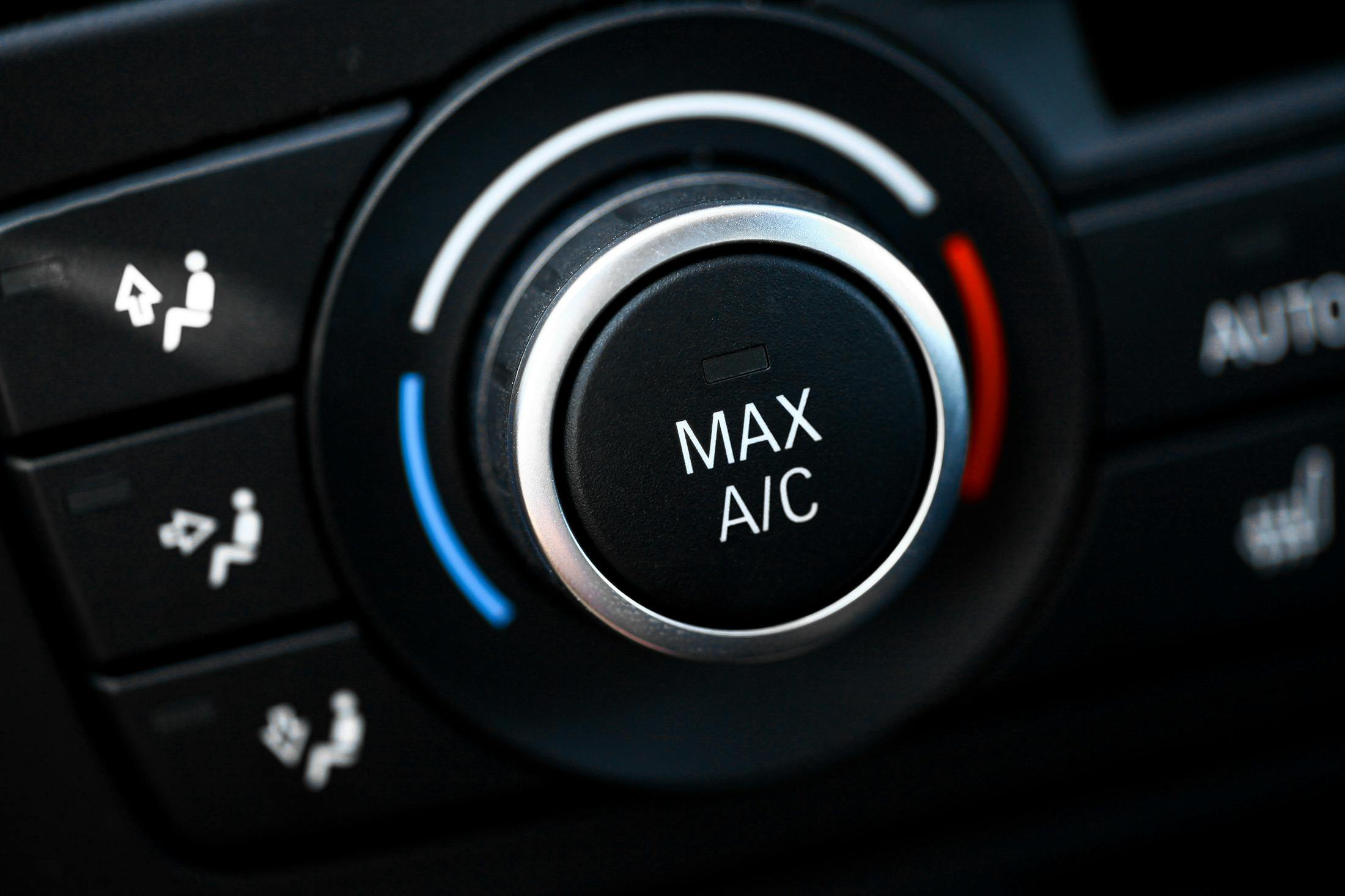 A climate control knob on a vehicle dashboard