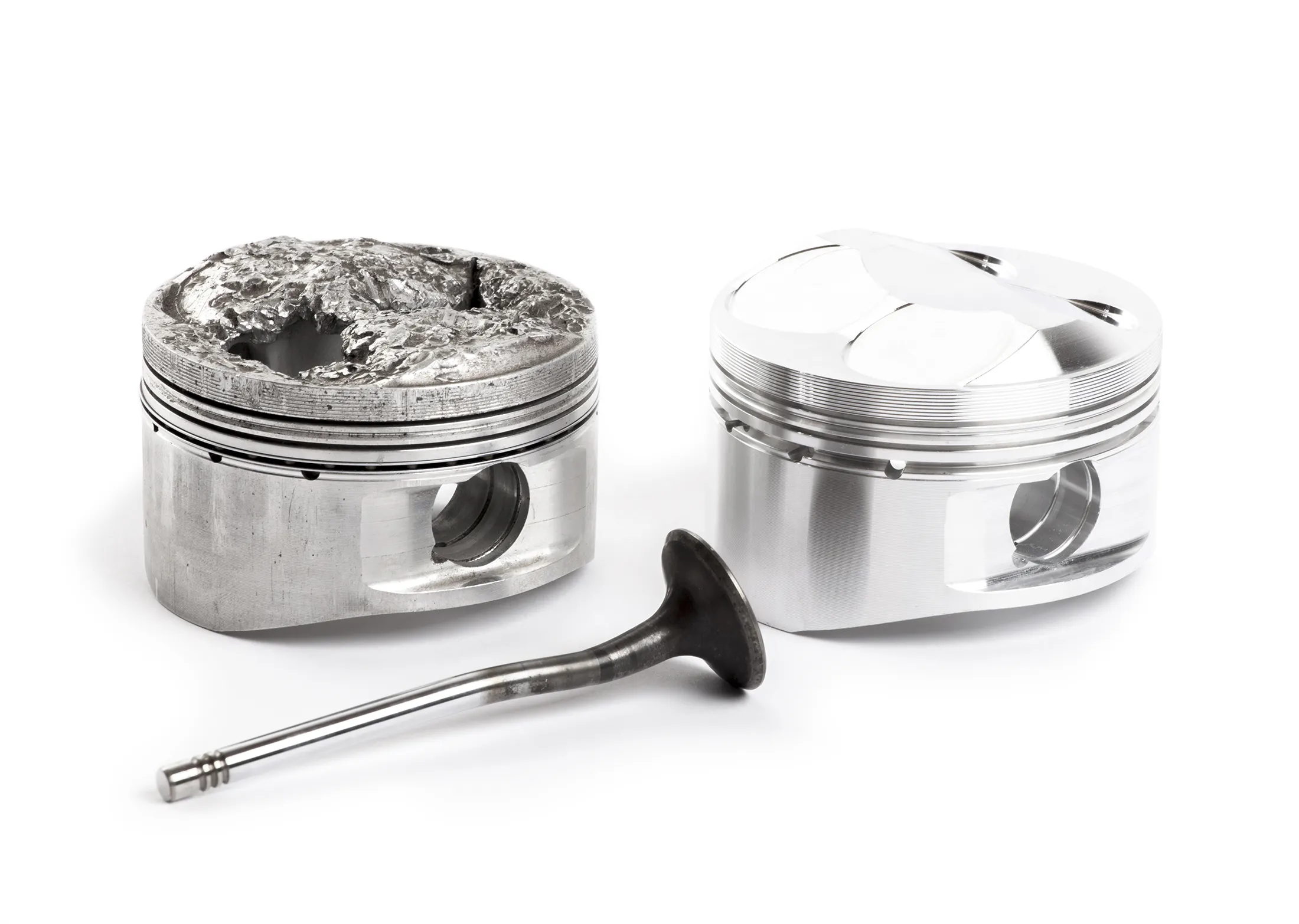 a damaged piston, new piston and valve