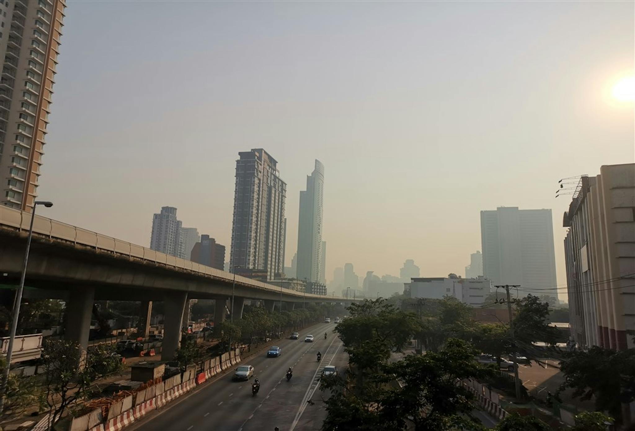 Smog over an Asian city caused by a combination of vehicle exhaust and industrial pollutants.
