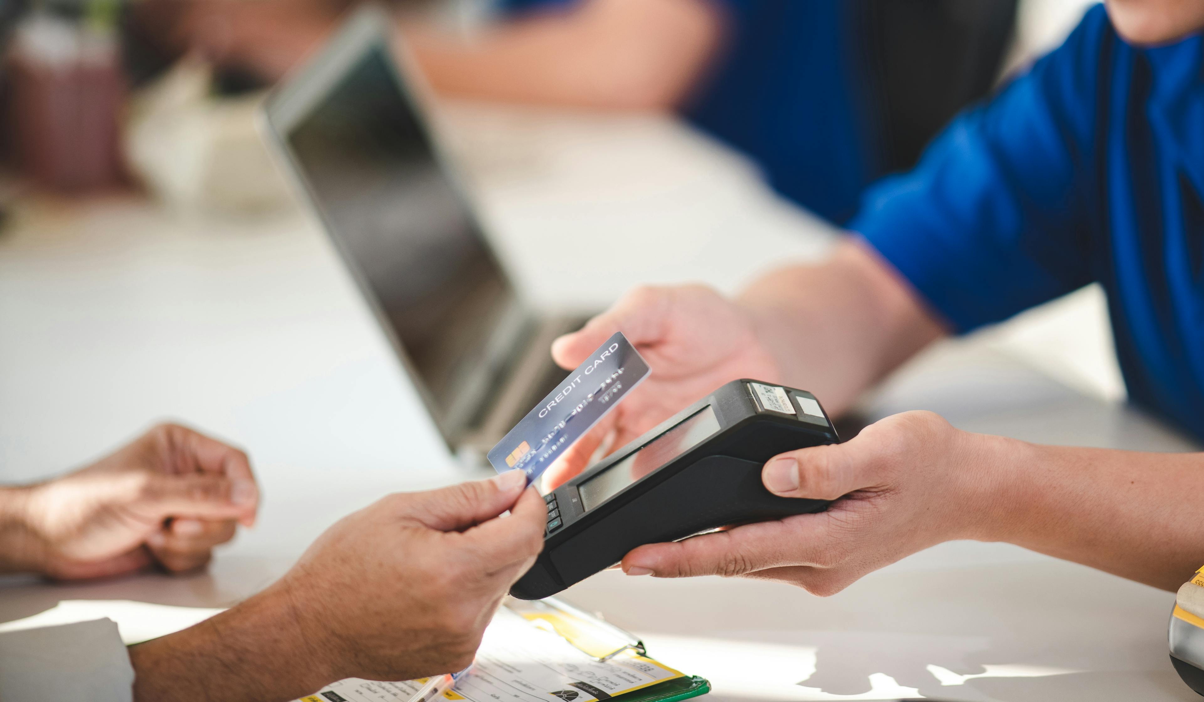 Customer paying with a credit card on an EFTPOS terminal