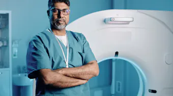 Doctor in front of MRI machine