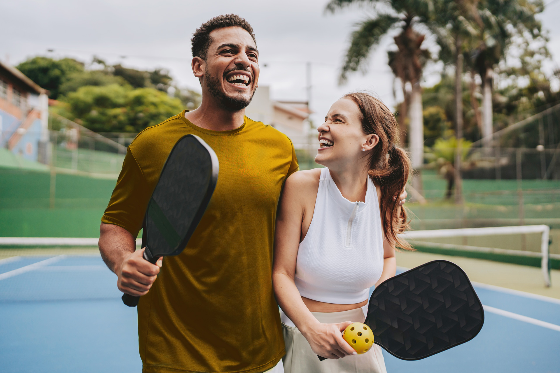 Man and woman playing pickleball