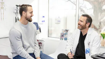 Male patient speaking to doctor