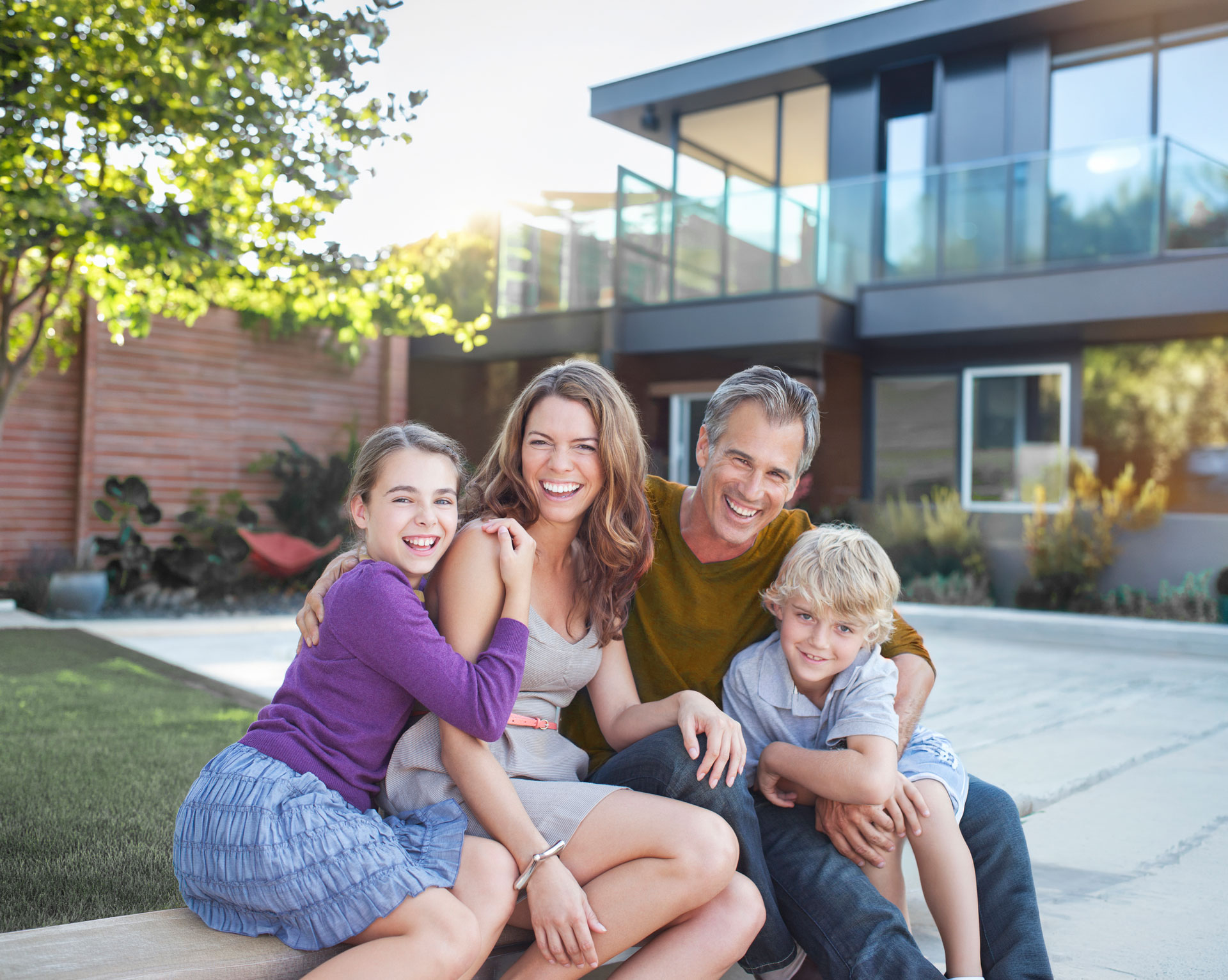 Family posing and smiling