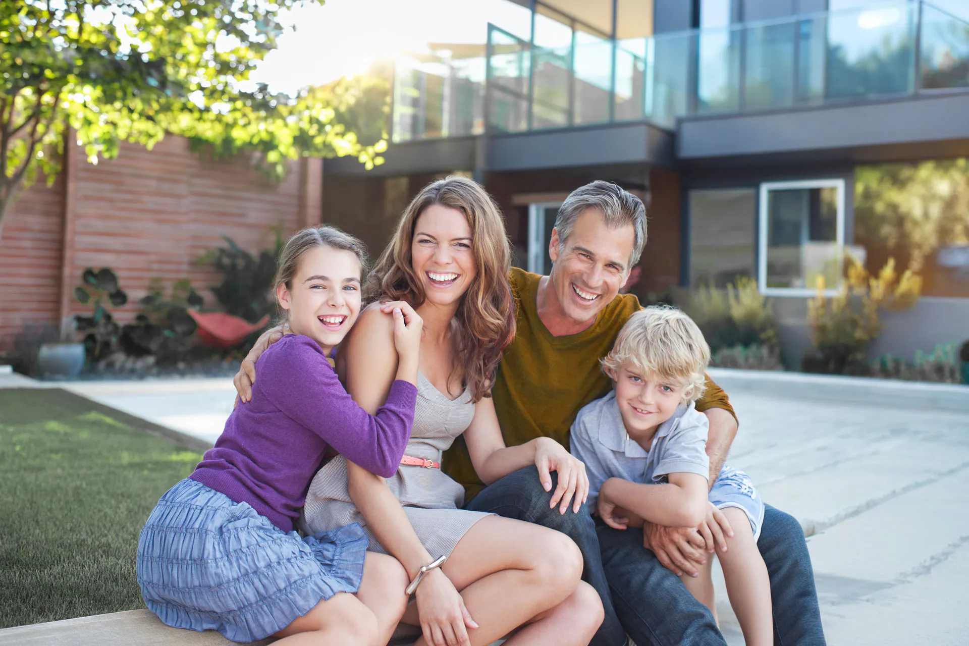 Family posing and smiling