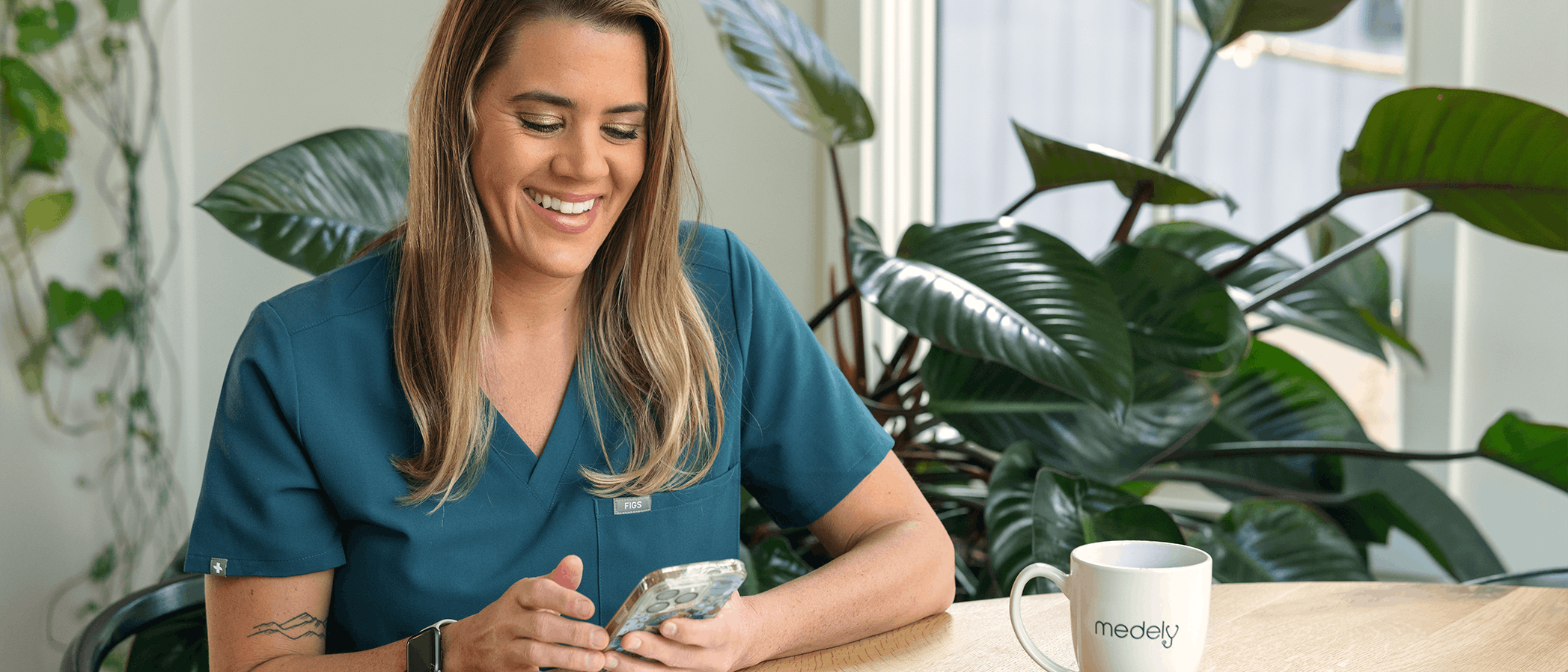 Nurse Lorelei on phone at kitchen table