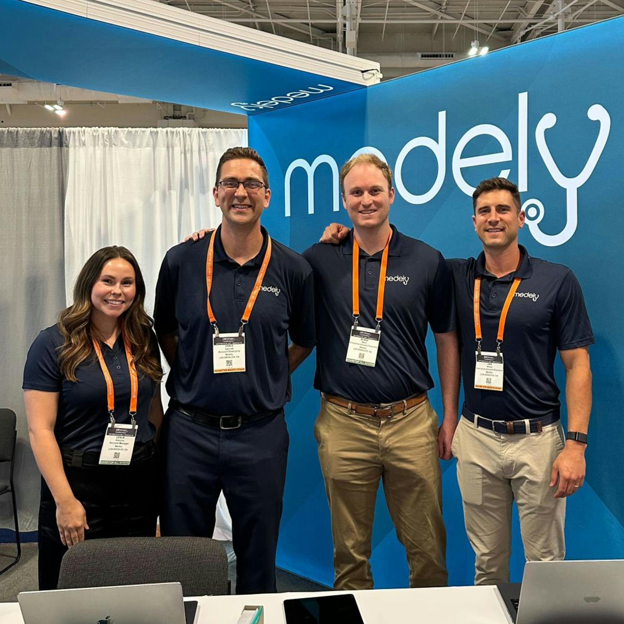 Medely team together at a conference