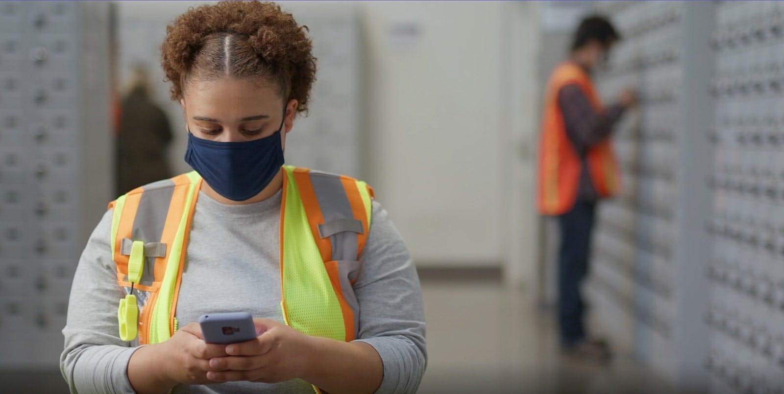 Amazon worker checking their phone