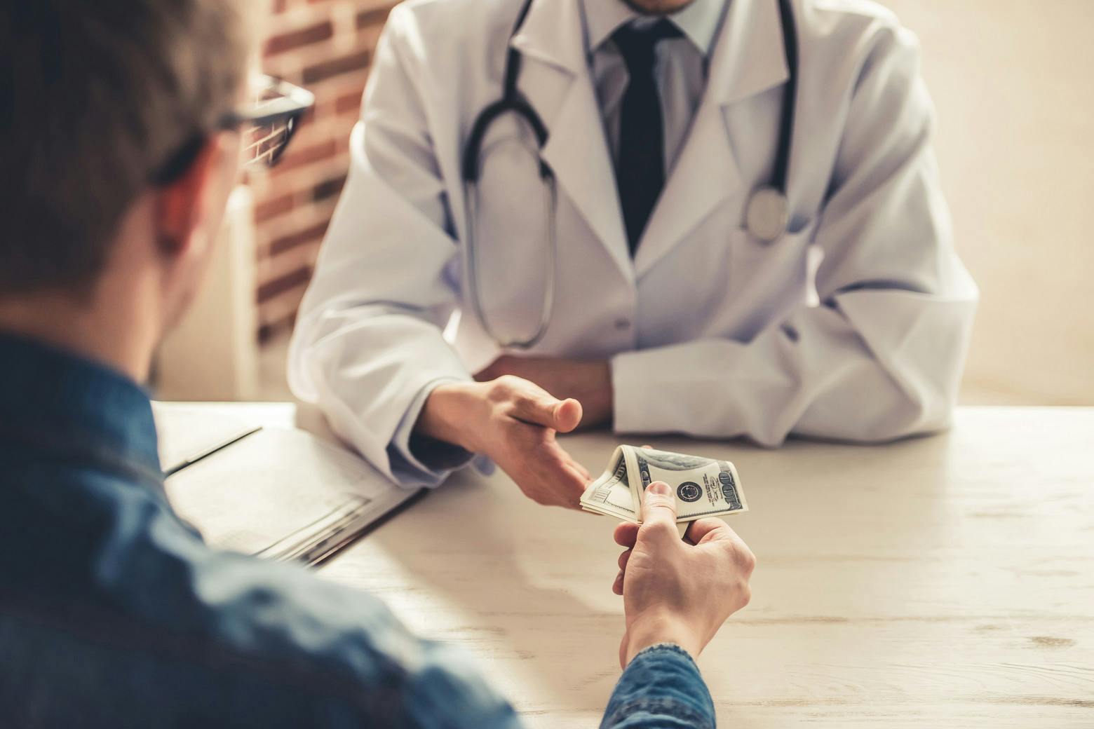 A physician being paid out by a pharmaceutical company