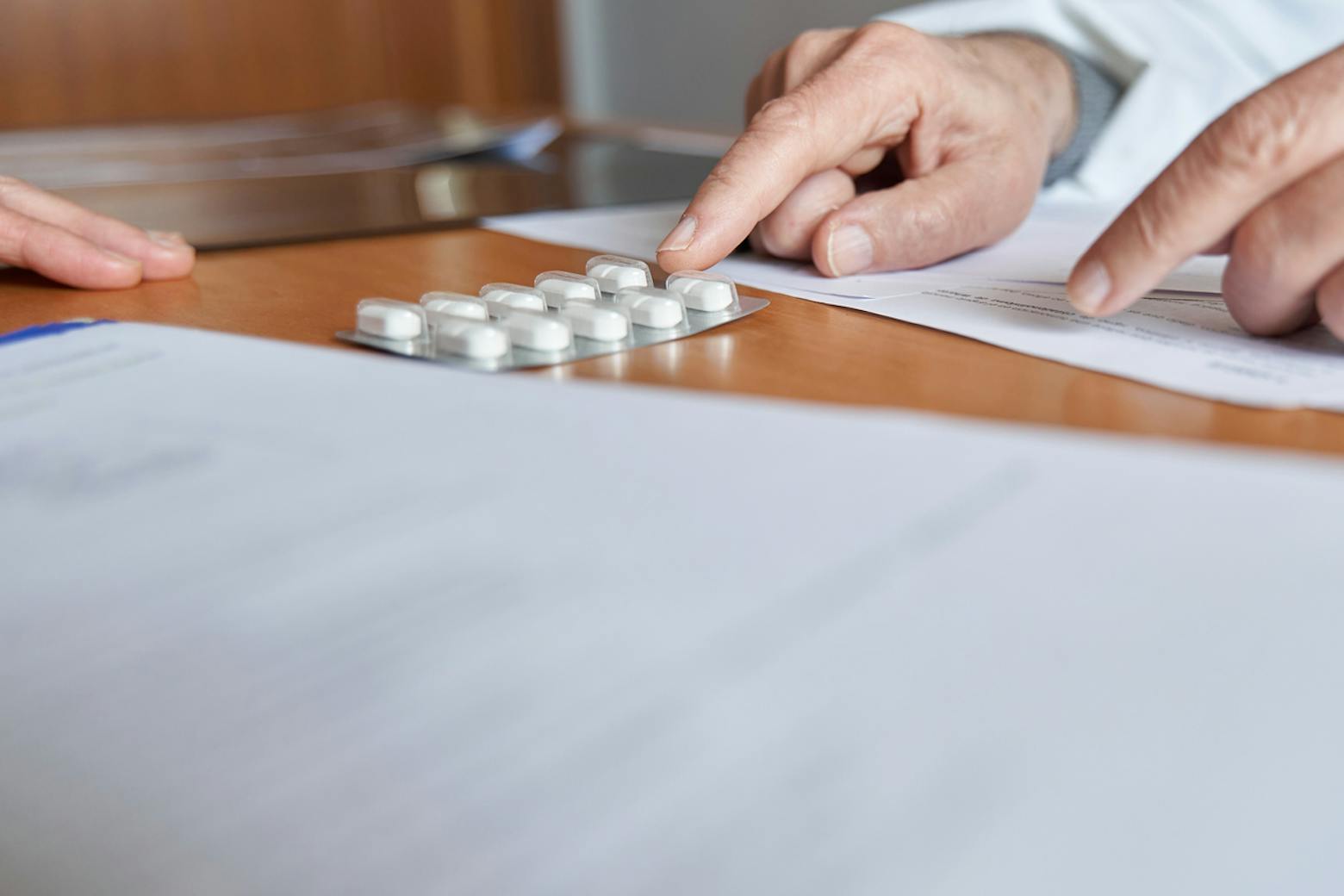 Doctor prescribing opioids representing the Kroger opioid settlement payout.