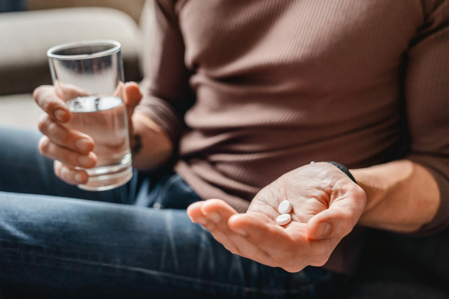 Image of a person holding Zantac pills representing the first zantac trials in the nation.