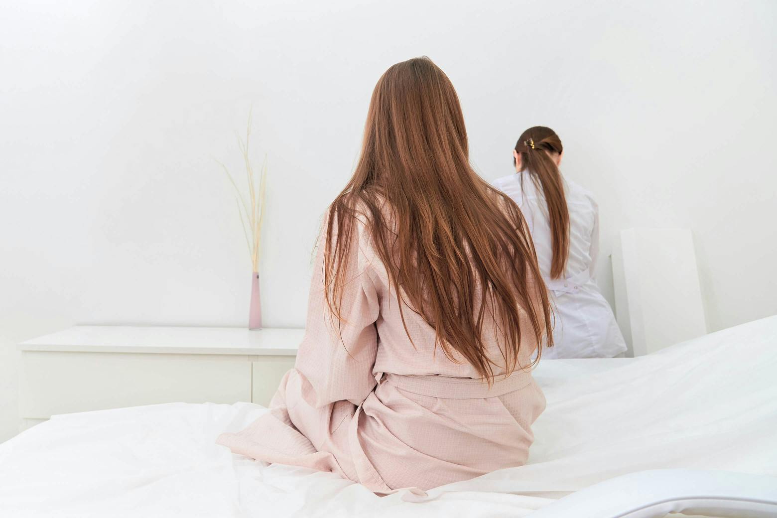 A photo of a woman in a doctor's office, refusing power morcellator treatment for uterine fibrioids after the FDA warning.
