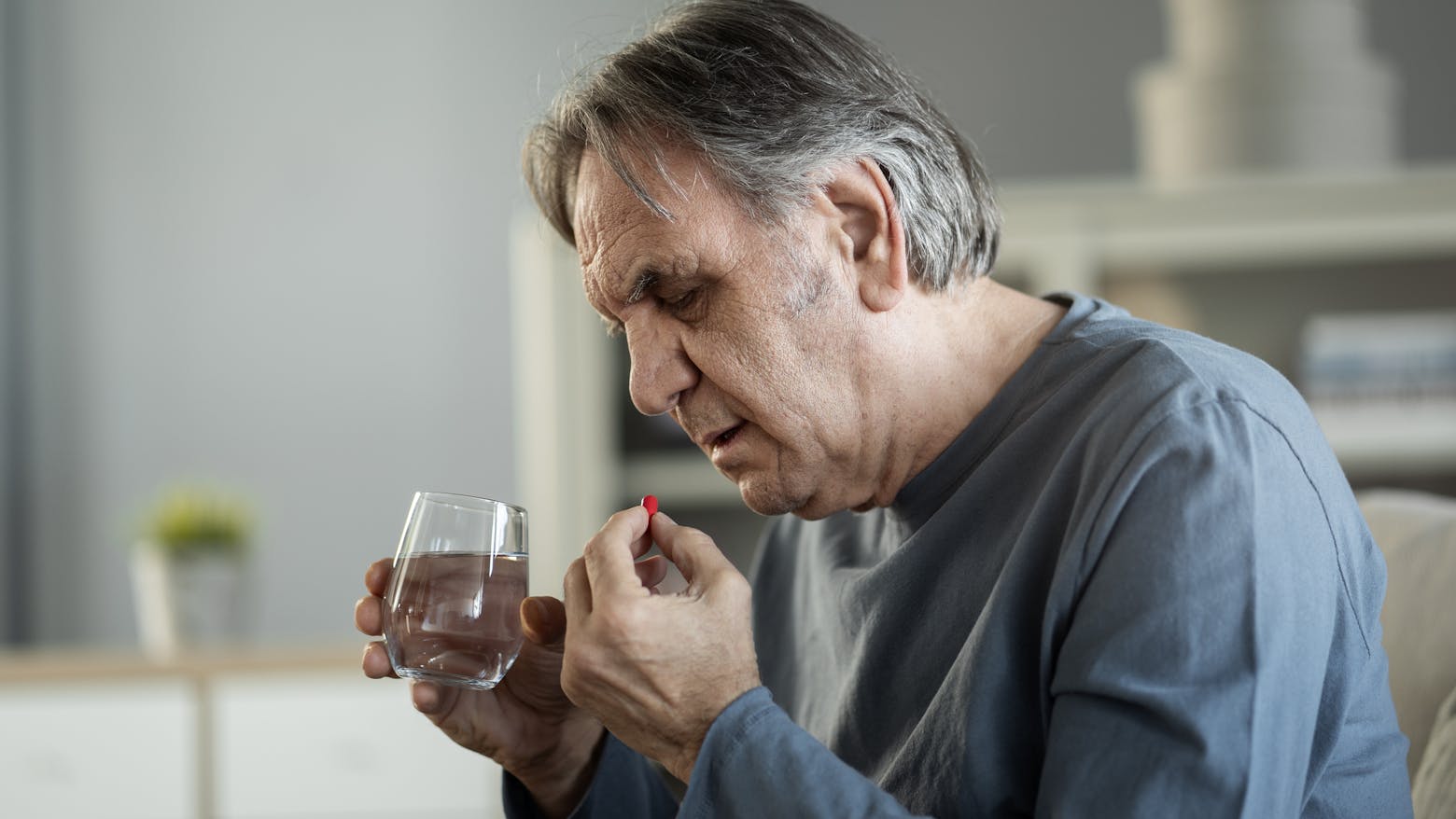 Man taking a pill representing the Zantac cancer lawsuits.