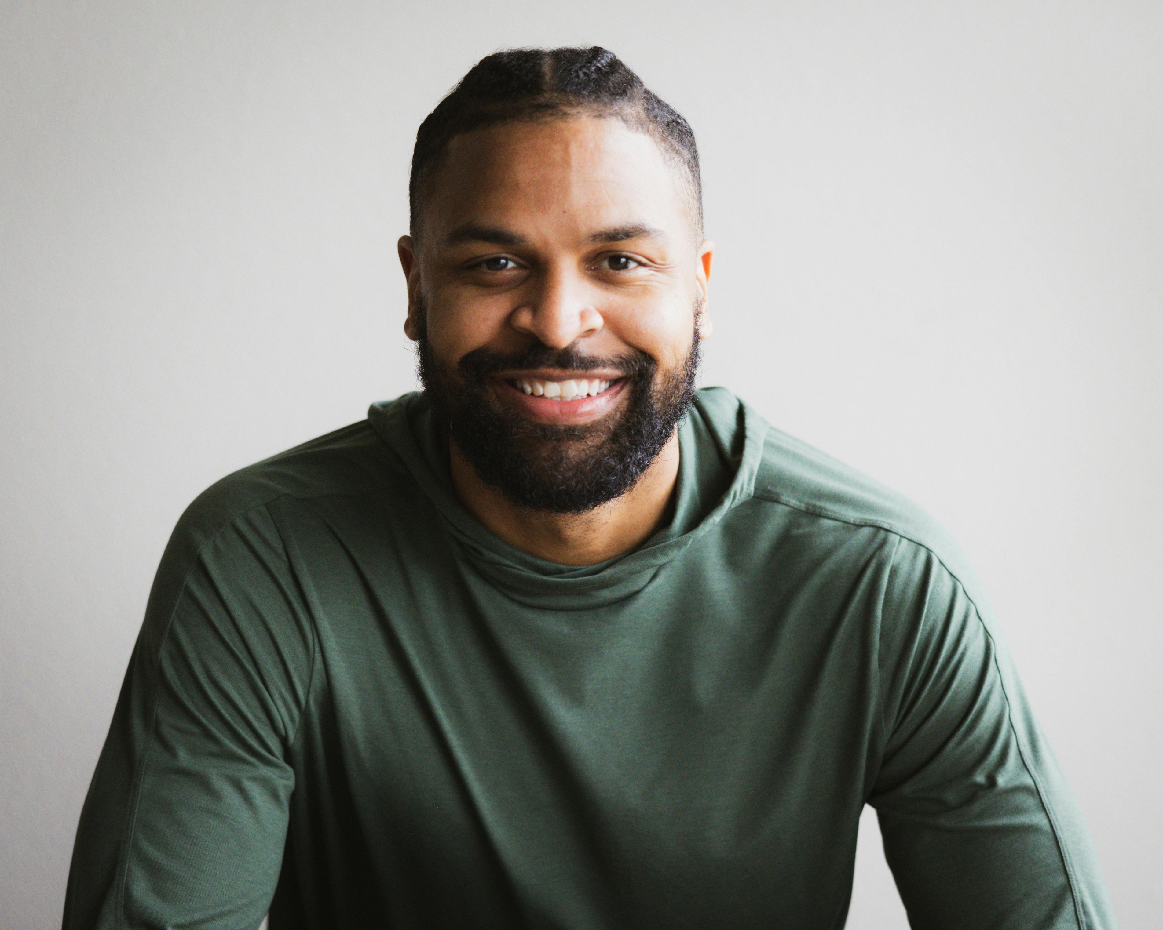 photographer/videographer smiling at the camera