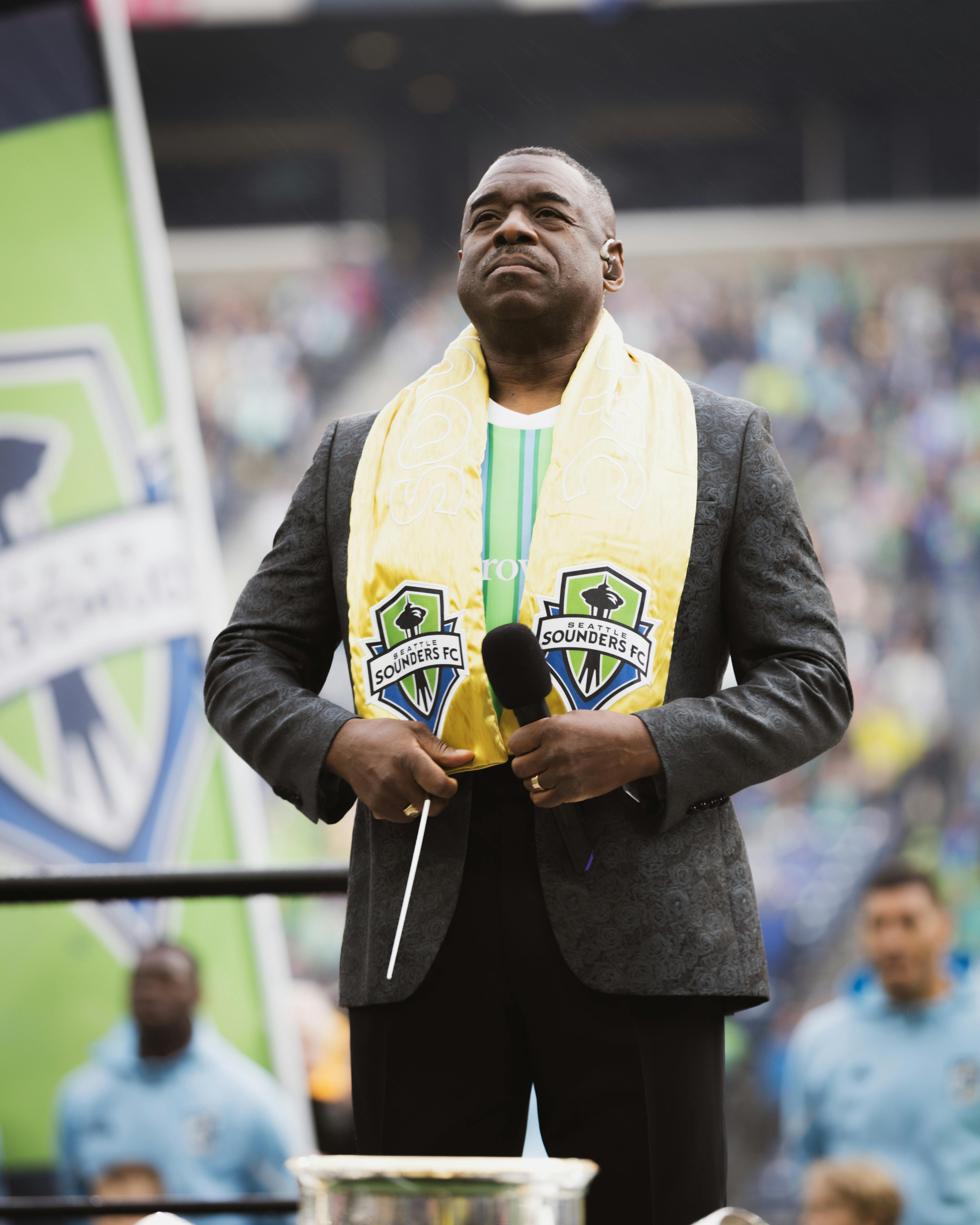 national anthem singer standing proud