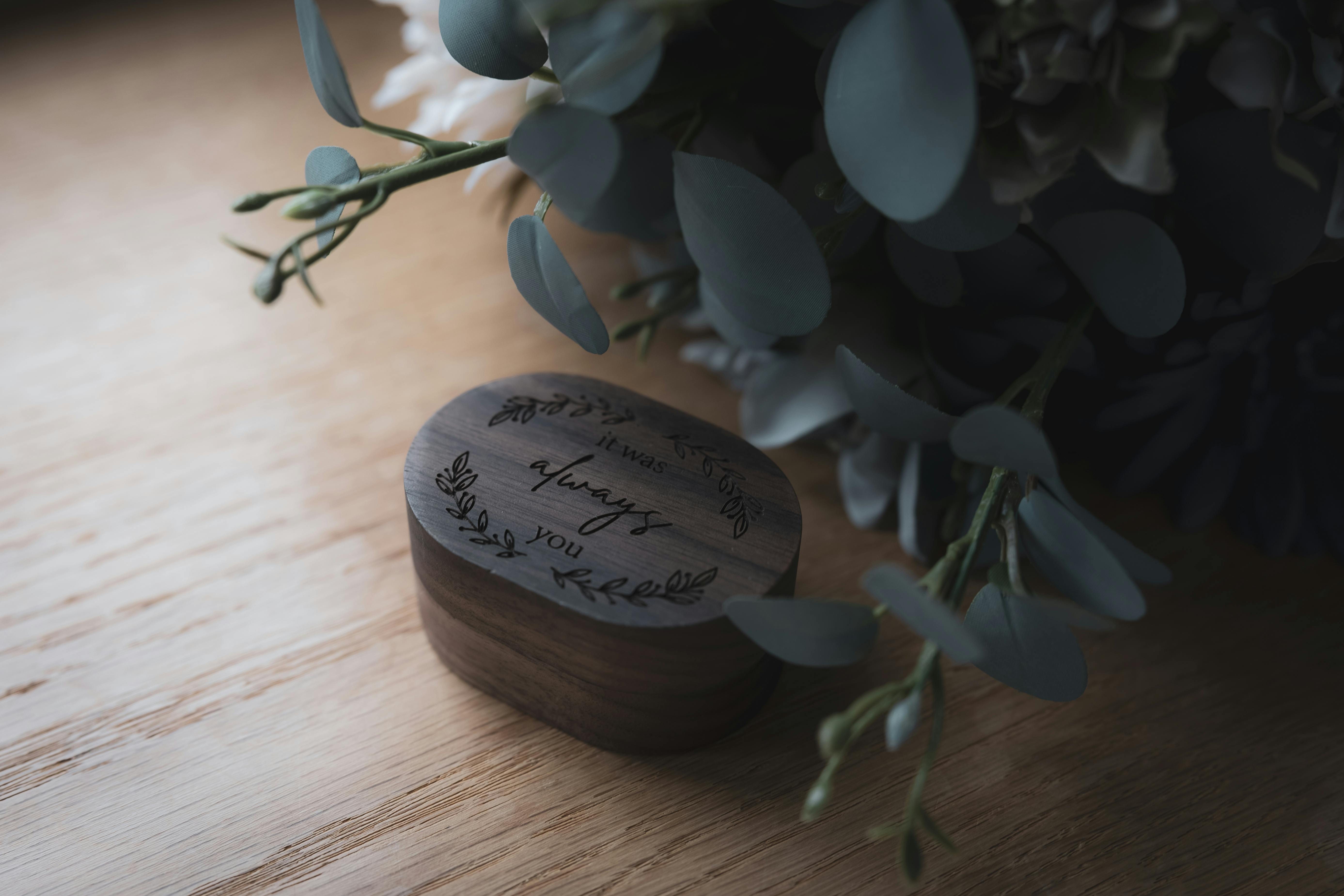 ring box and flowers with natural light shining through the window