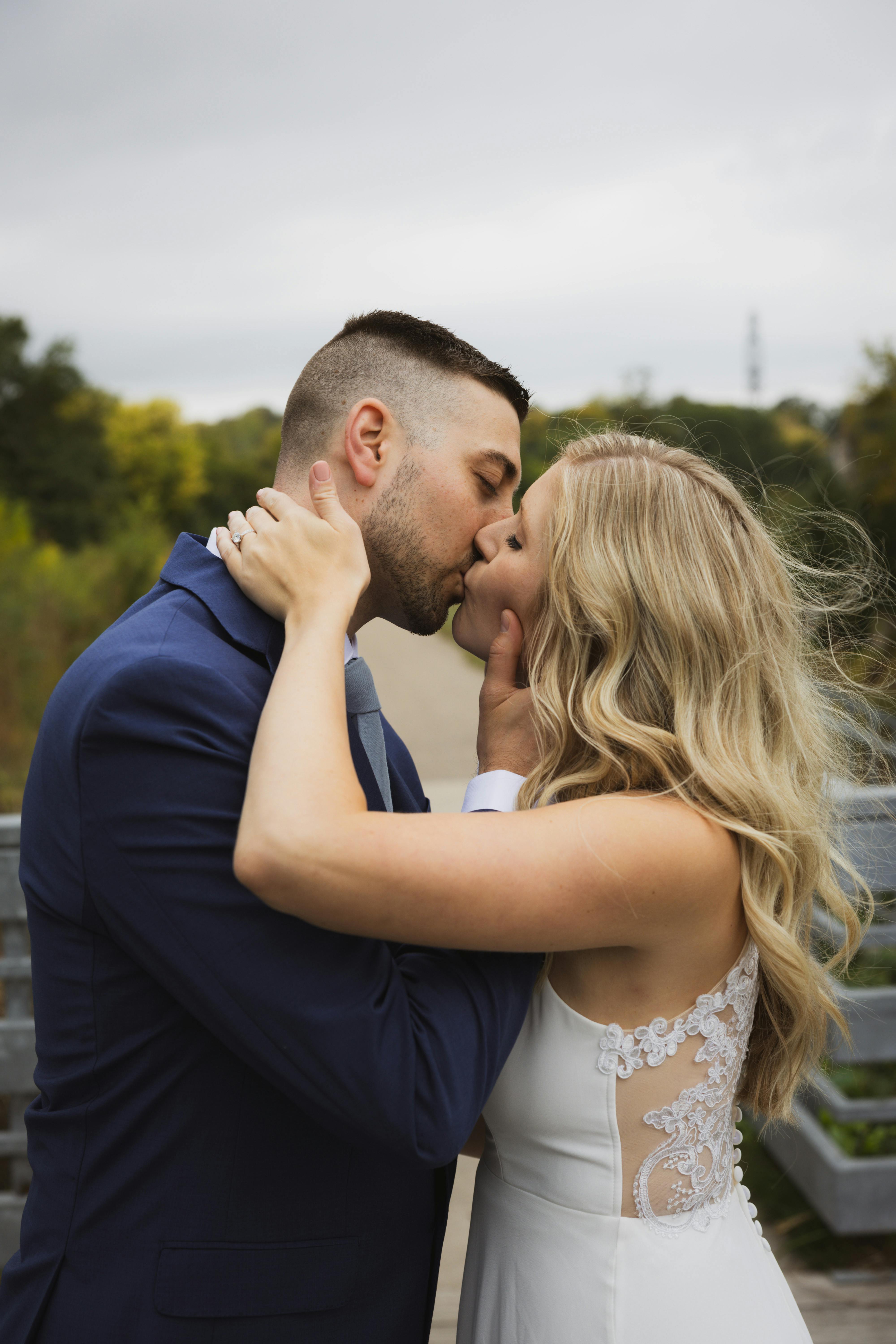 wife and husband kissing 