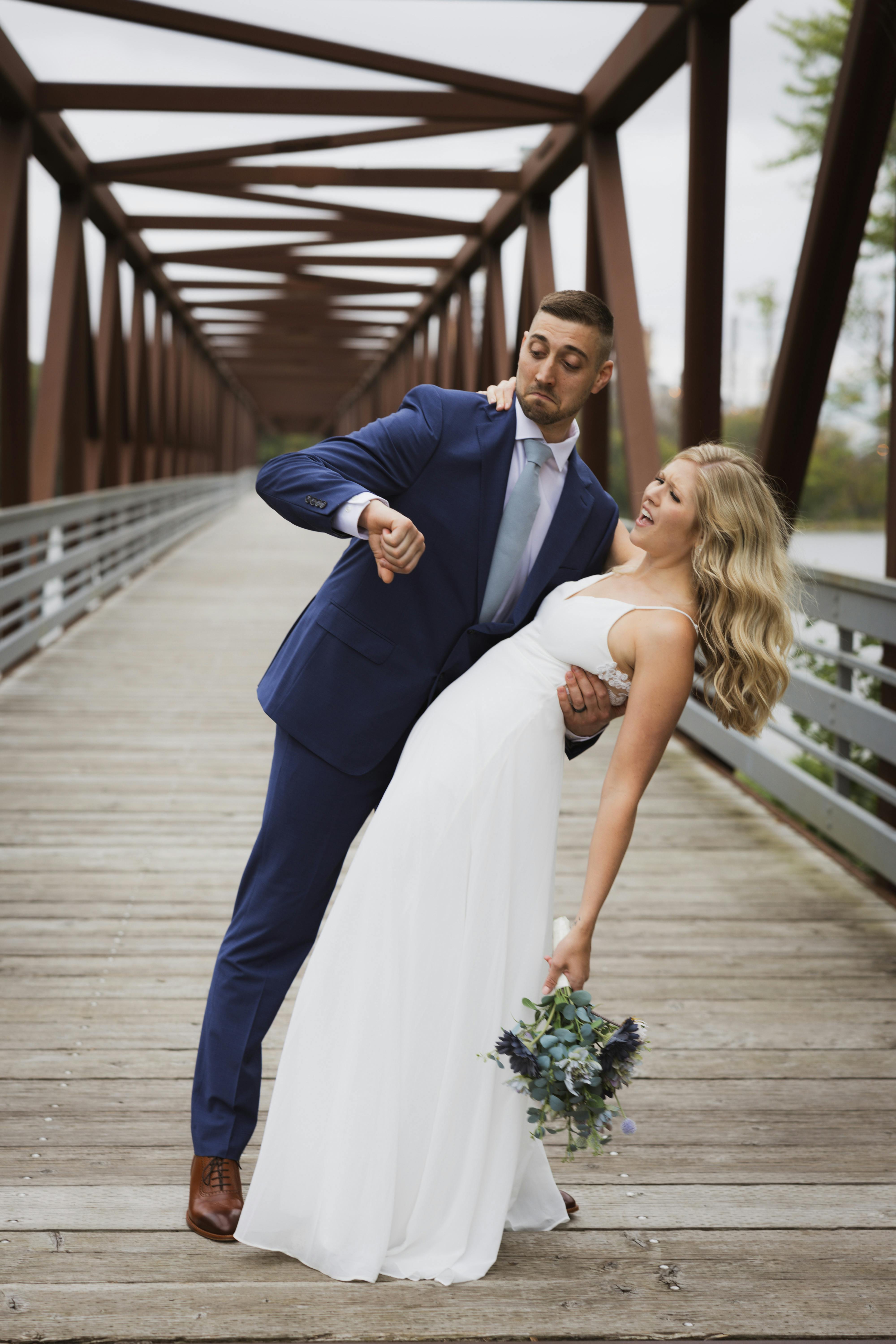 bride and groom being silly posing for the camera 